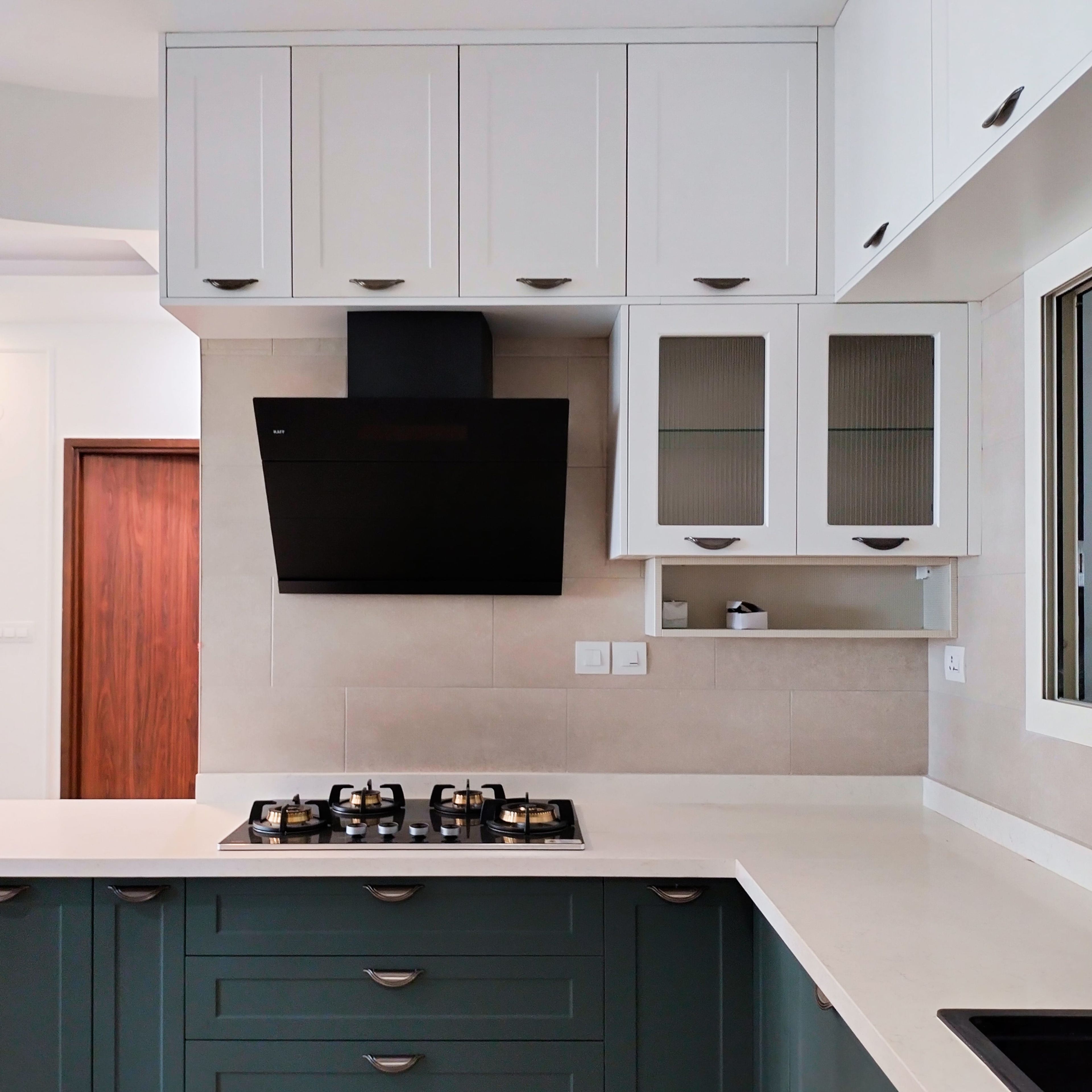 L-shaped kitchen design with white wall units
