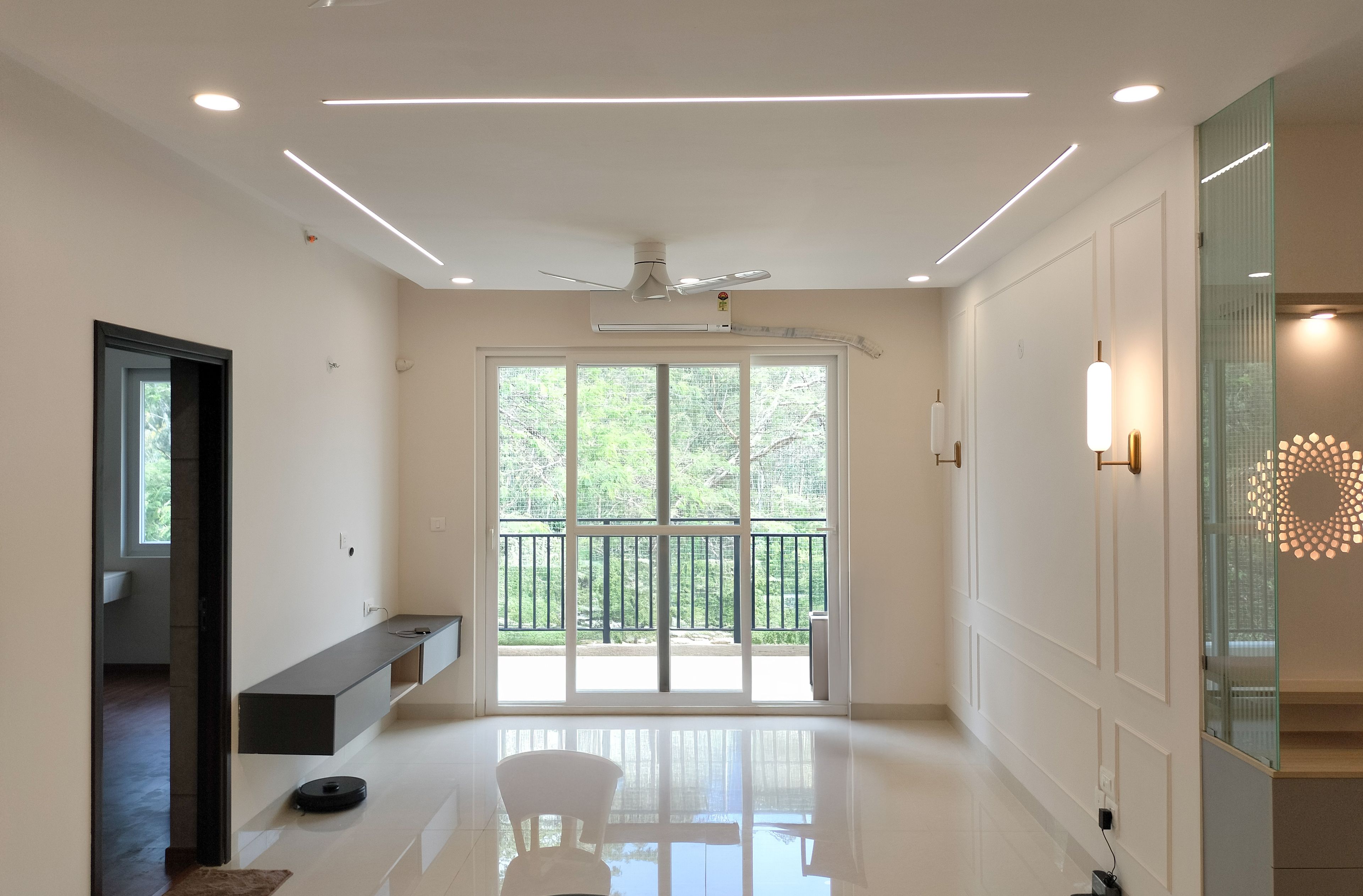 Living Room Design with Cream Wall with Trims and TV Unit