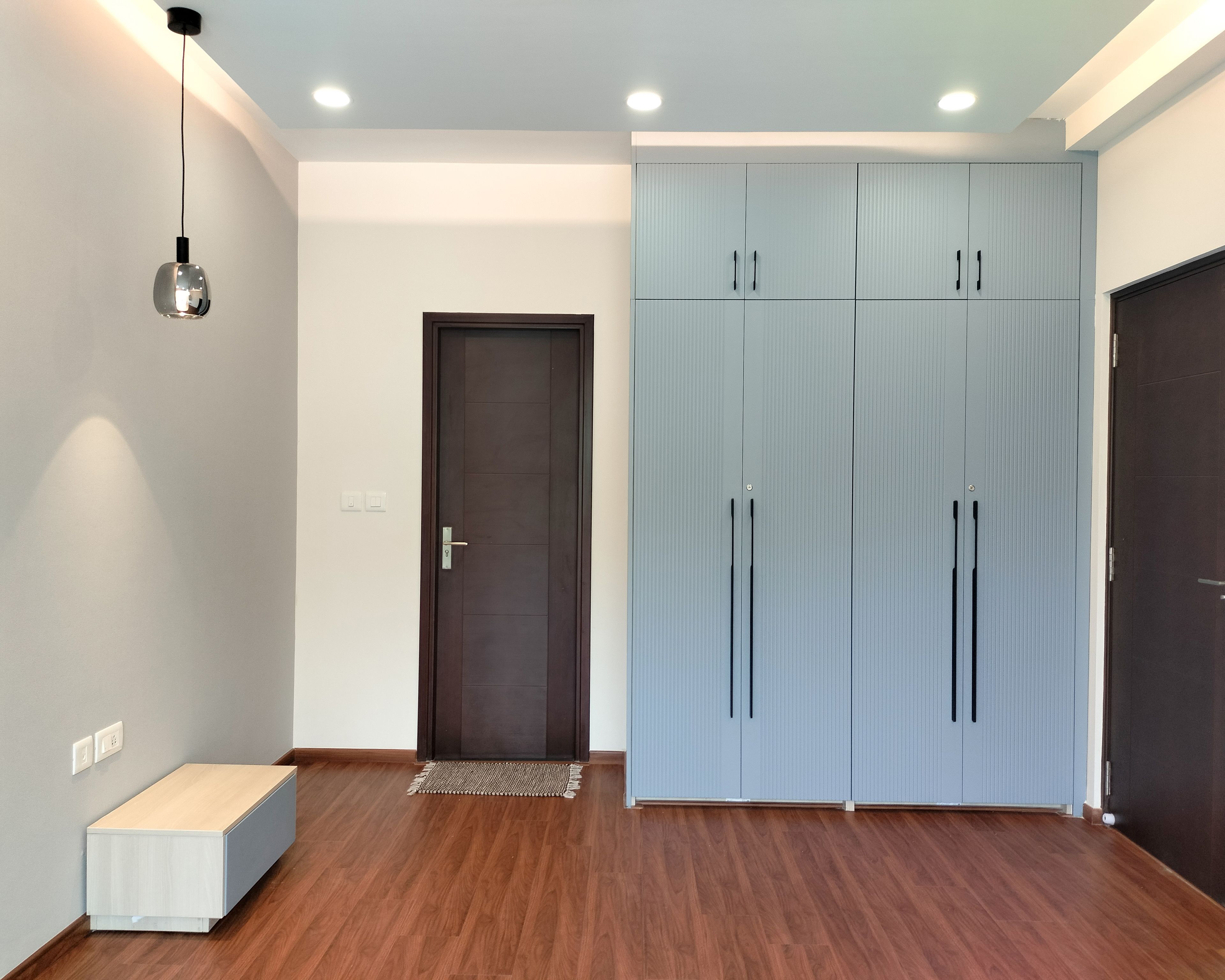 Bedroom design with 4-Door Blue Swing Wardrobe and White TV Unit Drawer