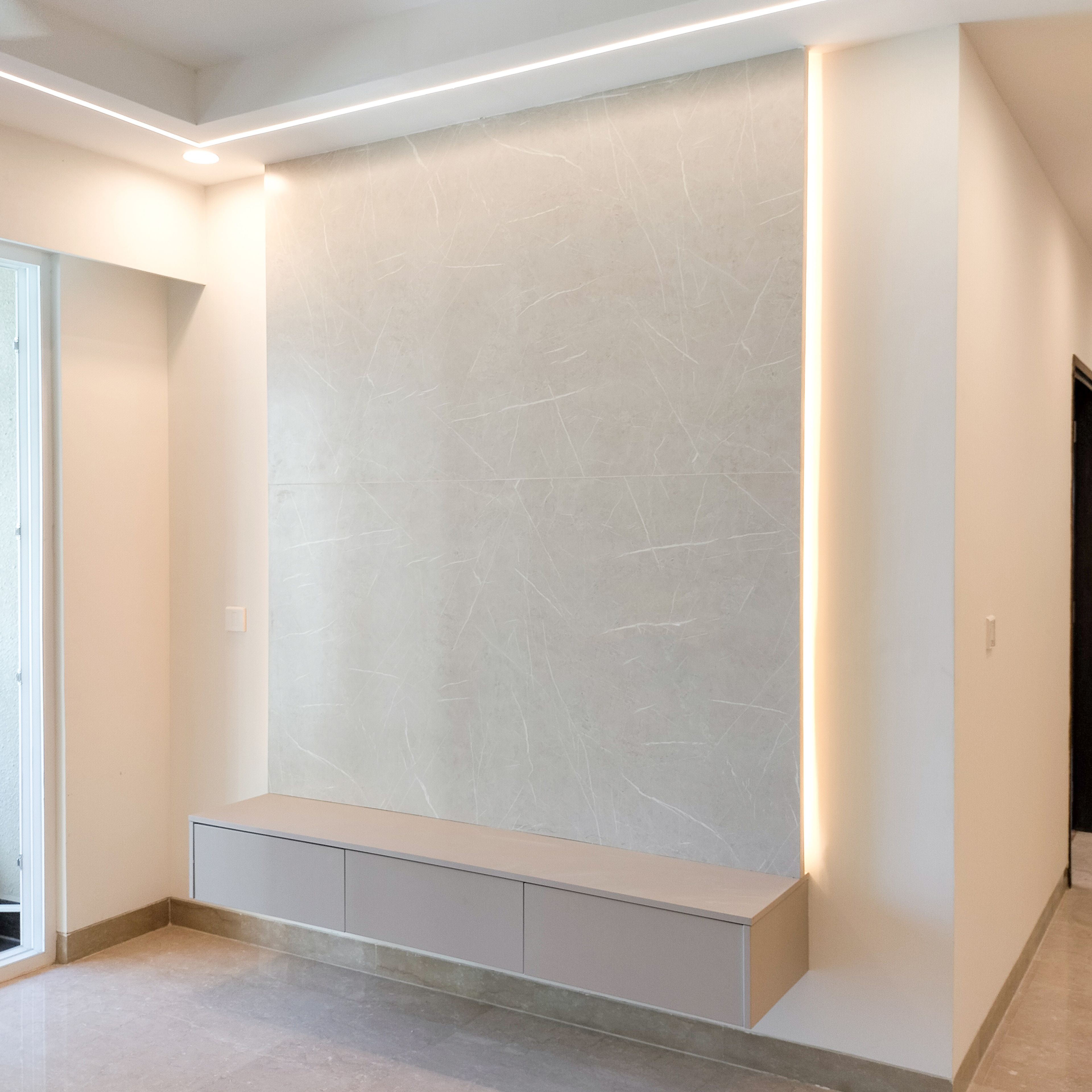 TV Unit Design with Beige Drawers and Marble Textured Backsplash Wall