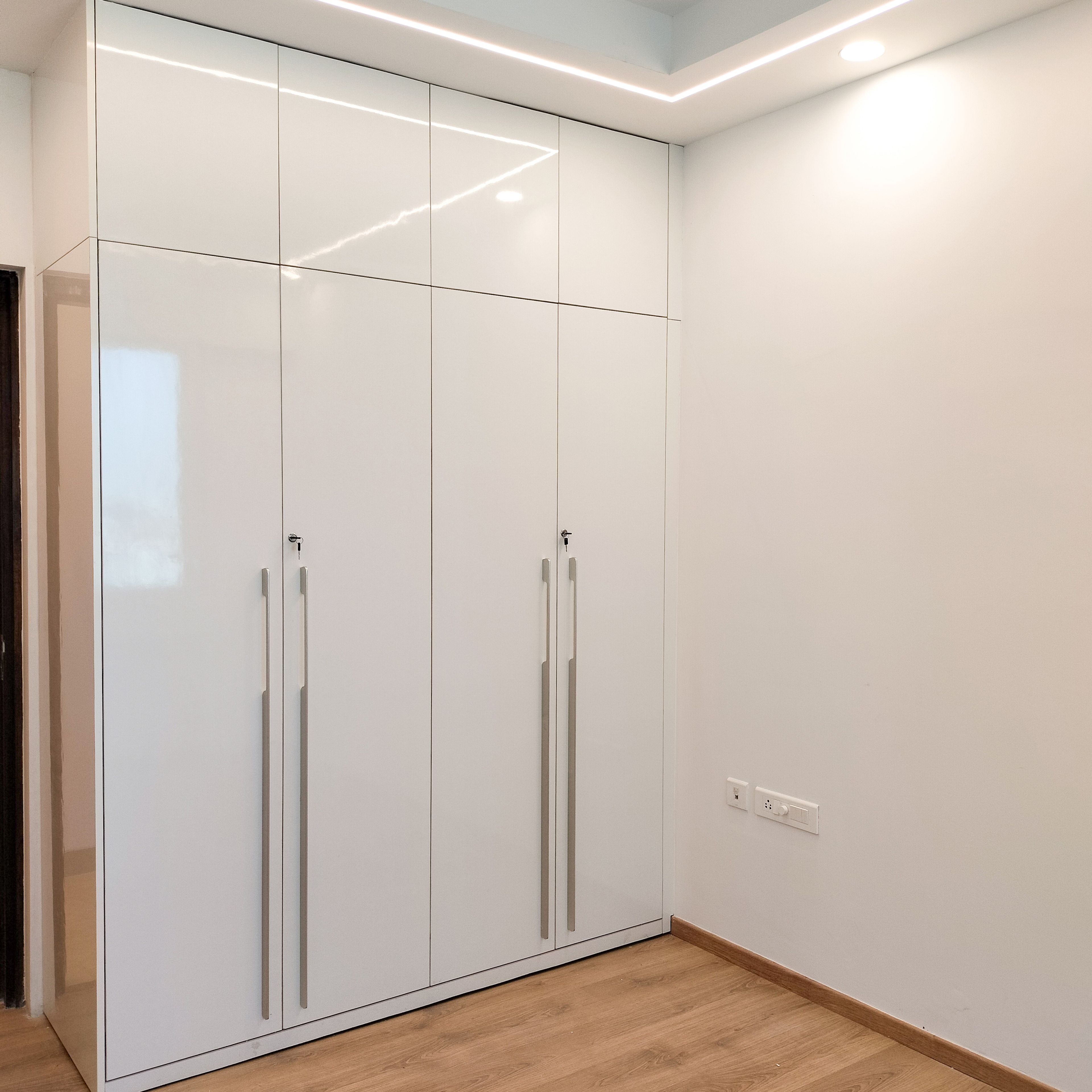 White 4-Door Swing Wardrobe Design with Loft