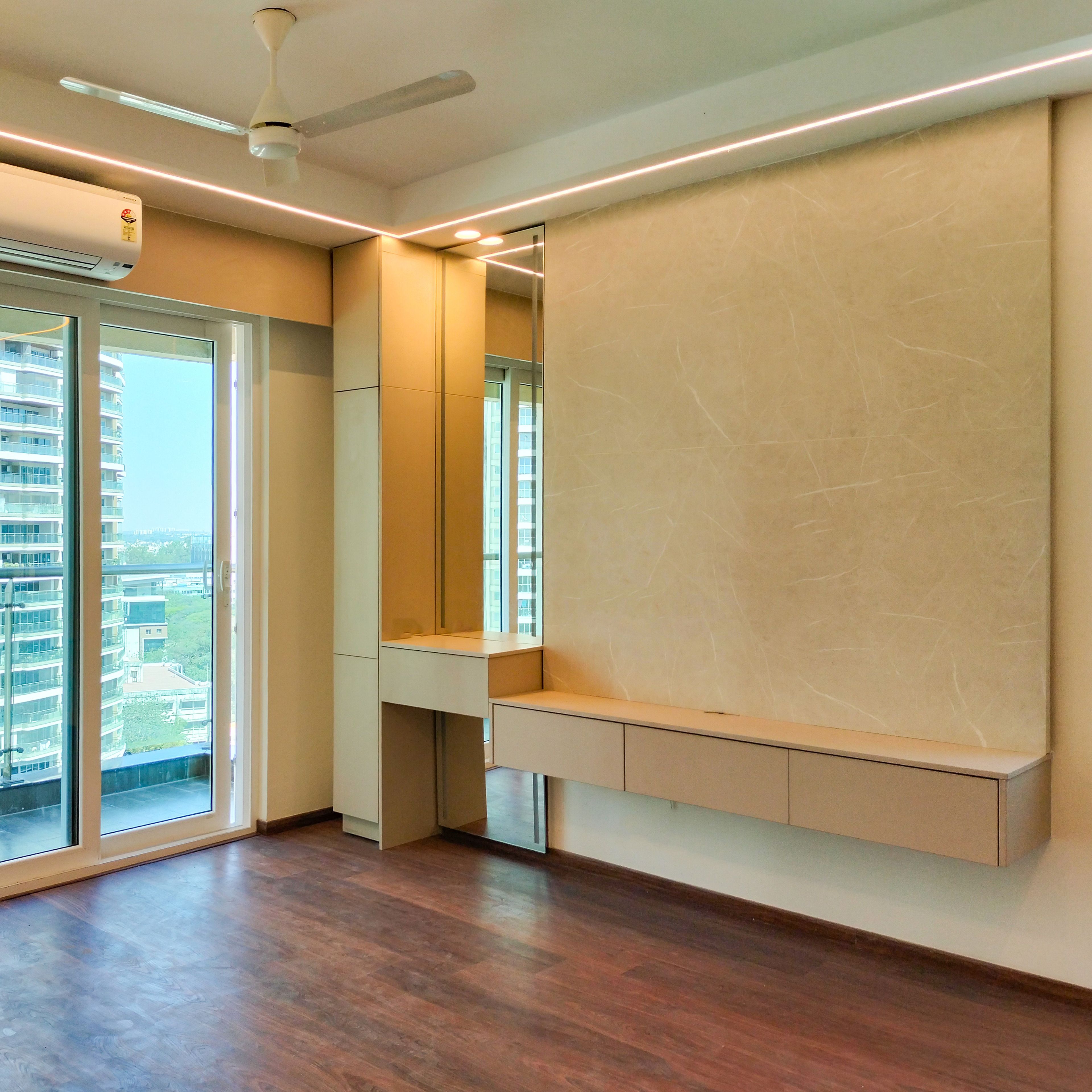 TV Unit Design with Beige Drawers and Marble Textured Backsplash Wall with Attached Mirror Dressing Unit