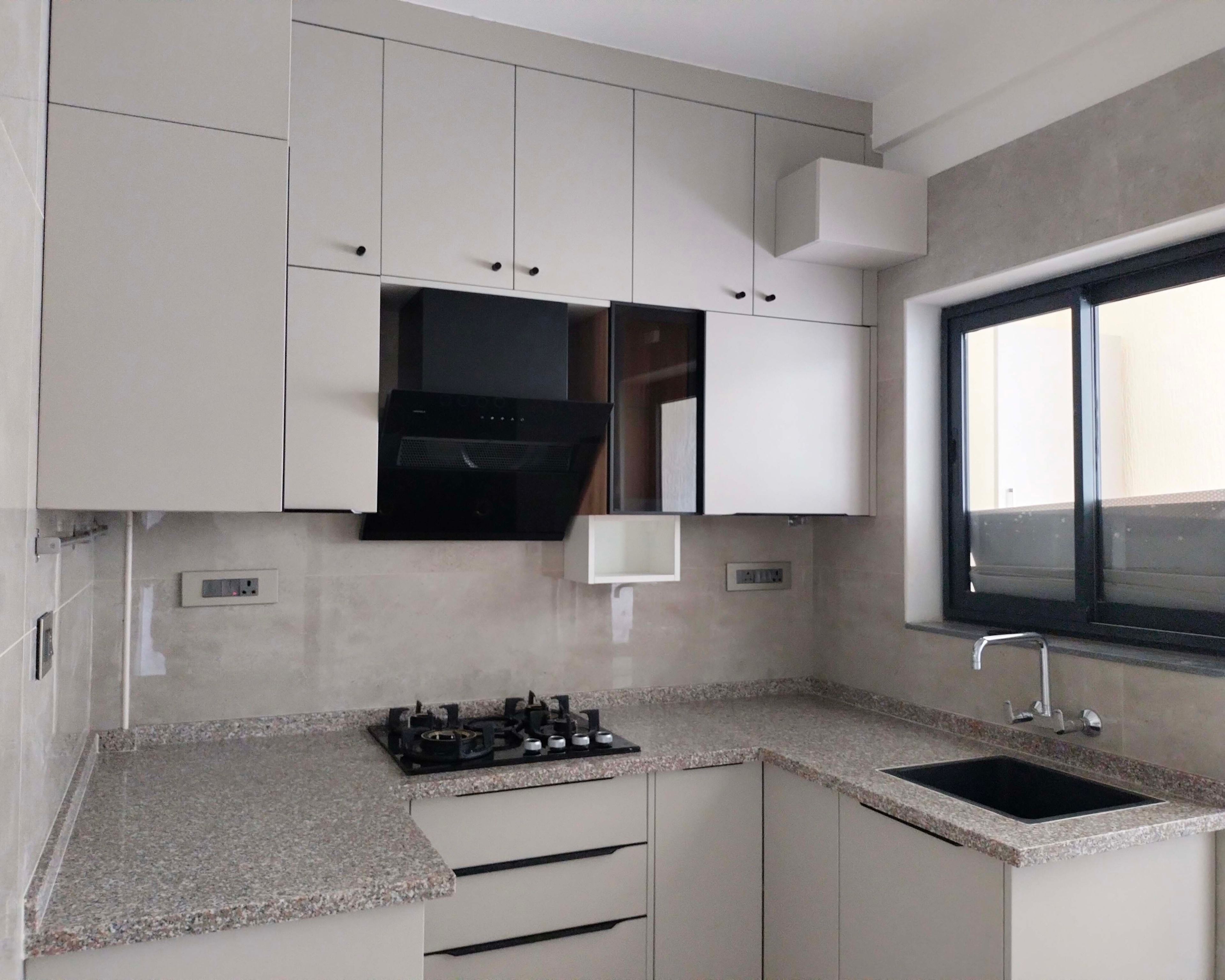 U-Shaped Kitchen Design with Granite Countertop and Beige Units