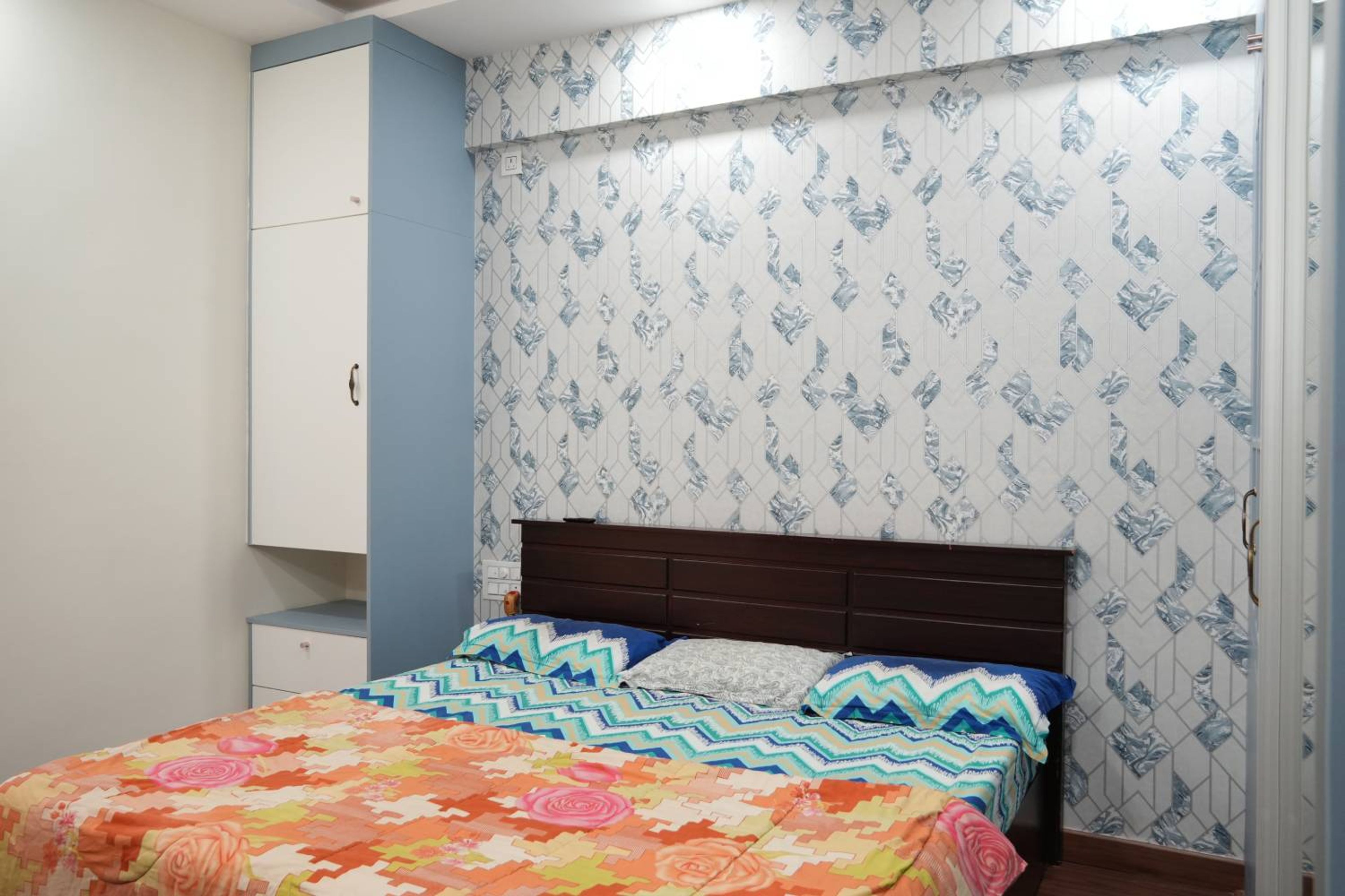 Master Bedroom Design with Wooden Storage and Wardrobe