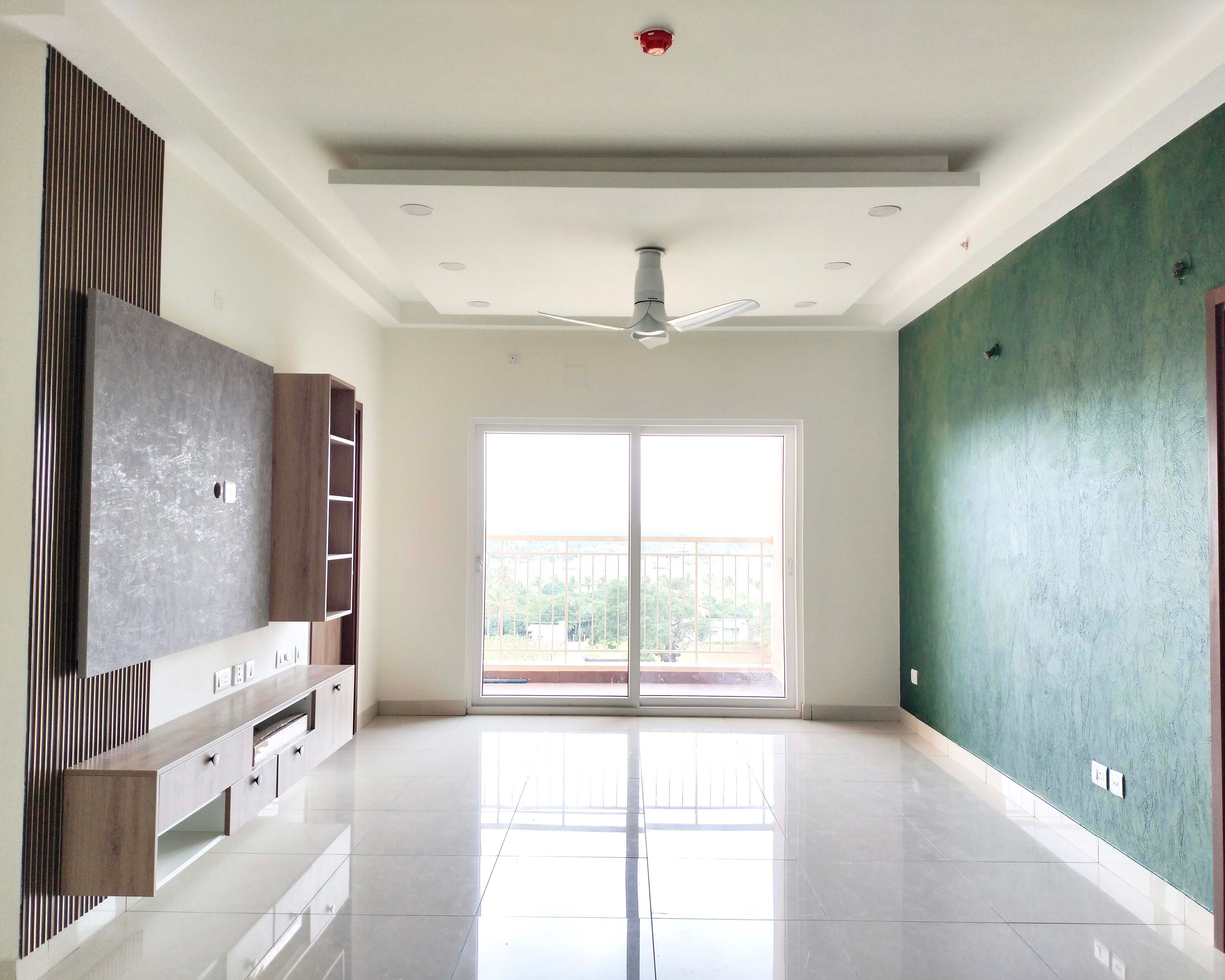 Living Room Design with Wooden TV Unit with Wall Mounted Tall Unit and Drawers and Green Patterned Wall