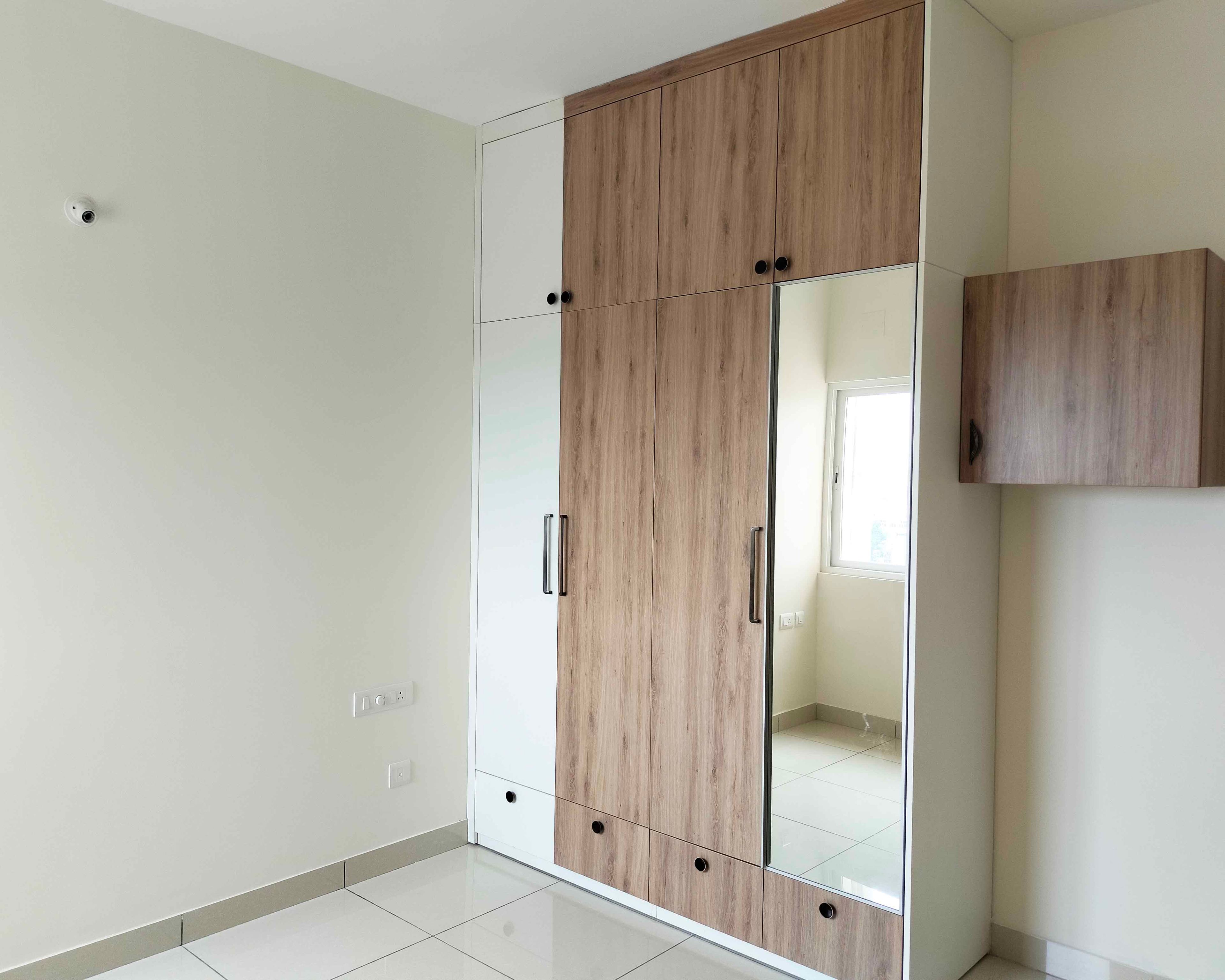 4-Door Wooden Swing Wardrobe Design with Integrated Mirror