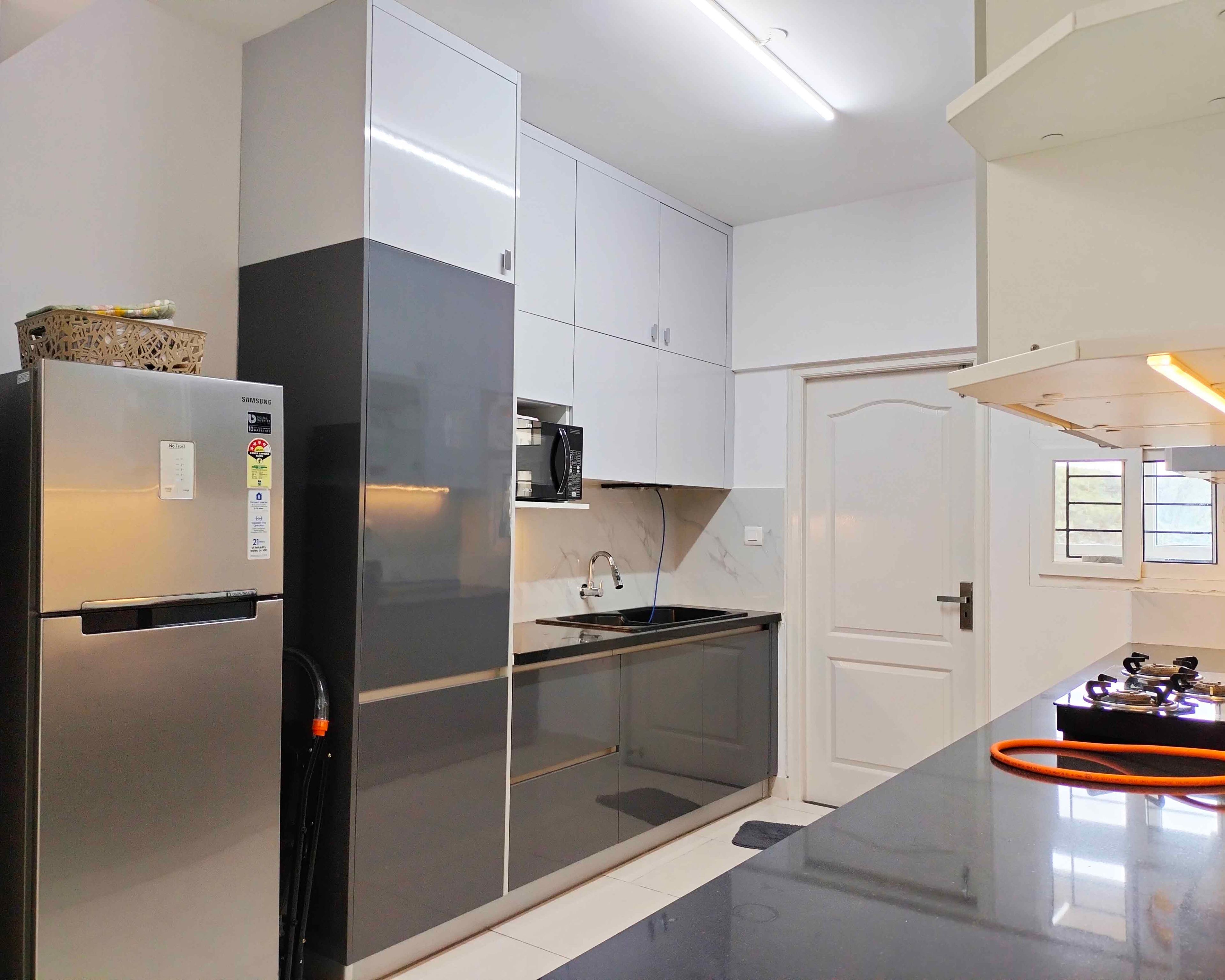 Parallel Kitchen Design with Dark Grey and White Units and Appliance Storage Unit