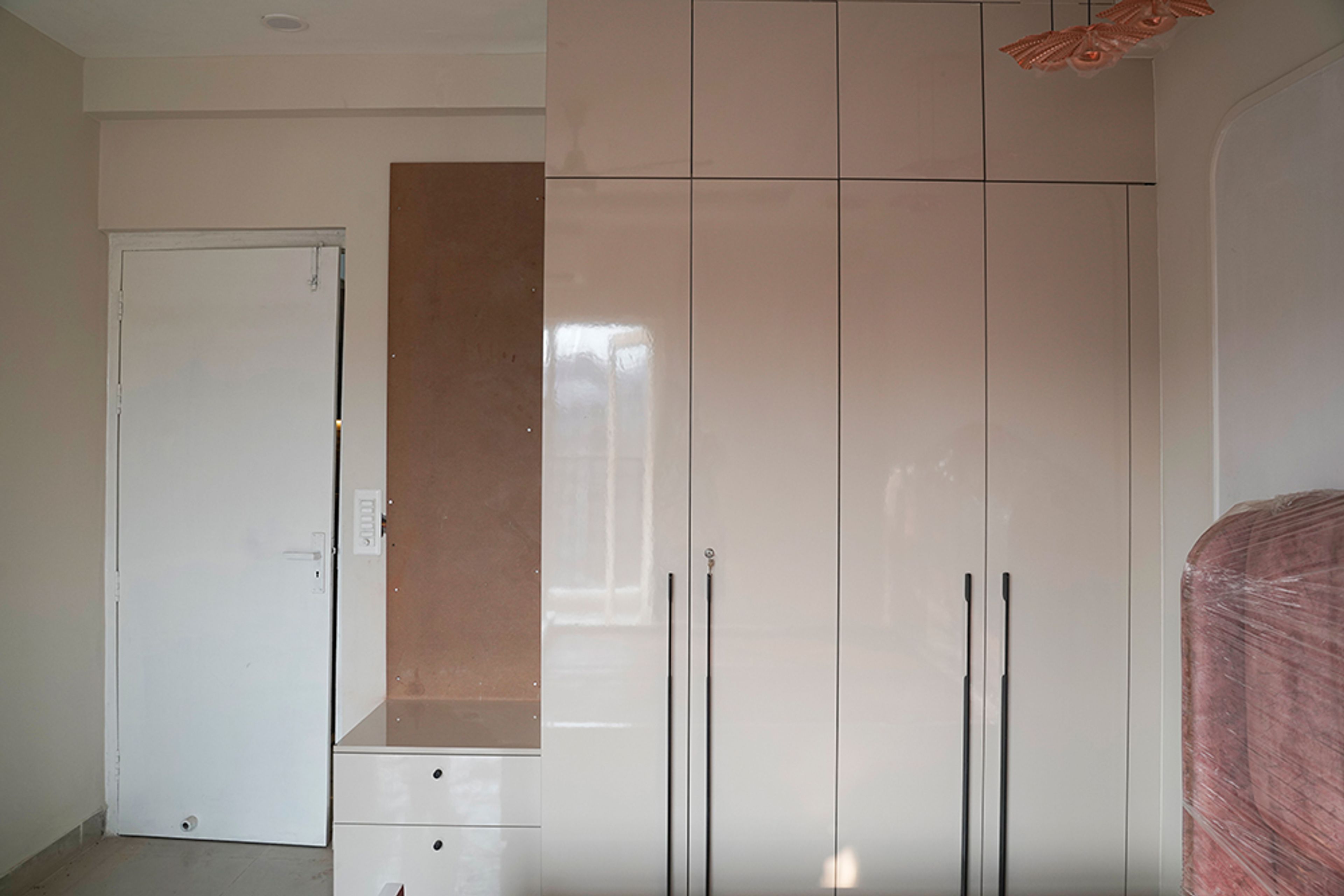 4-Door Glossy Beige Swing Wardrobe Design with Loft Unit