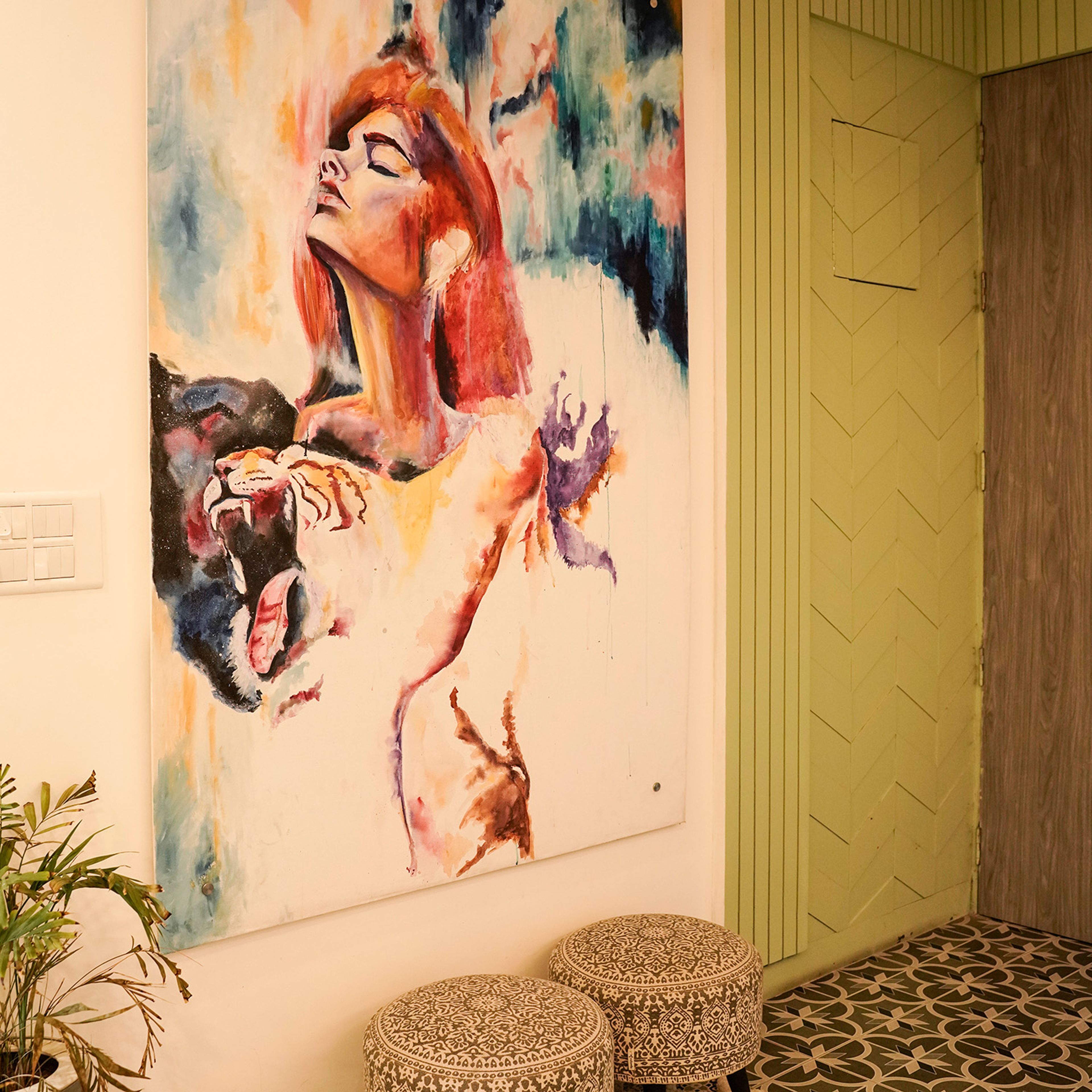 Art Nook with Large Abstract Wall Painting and Geometric Patterned Floor Tiles