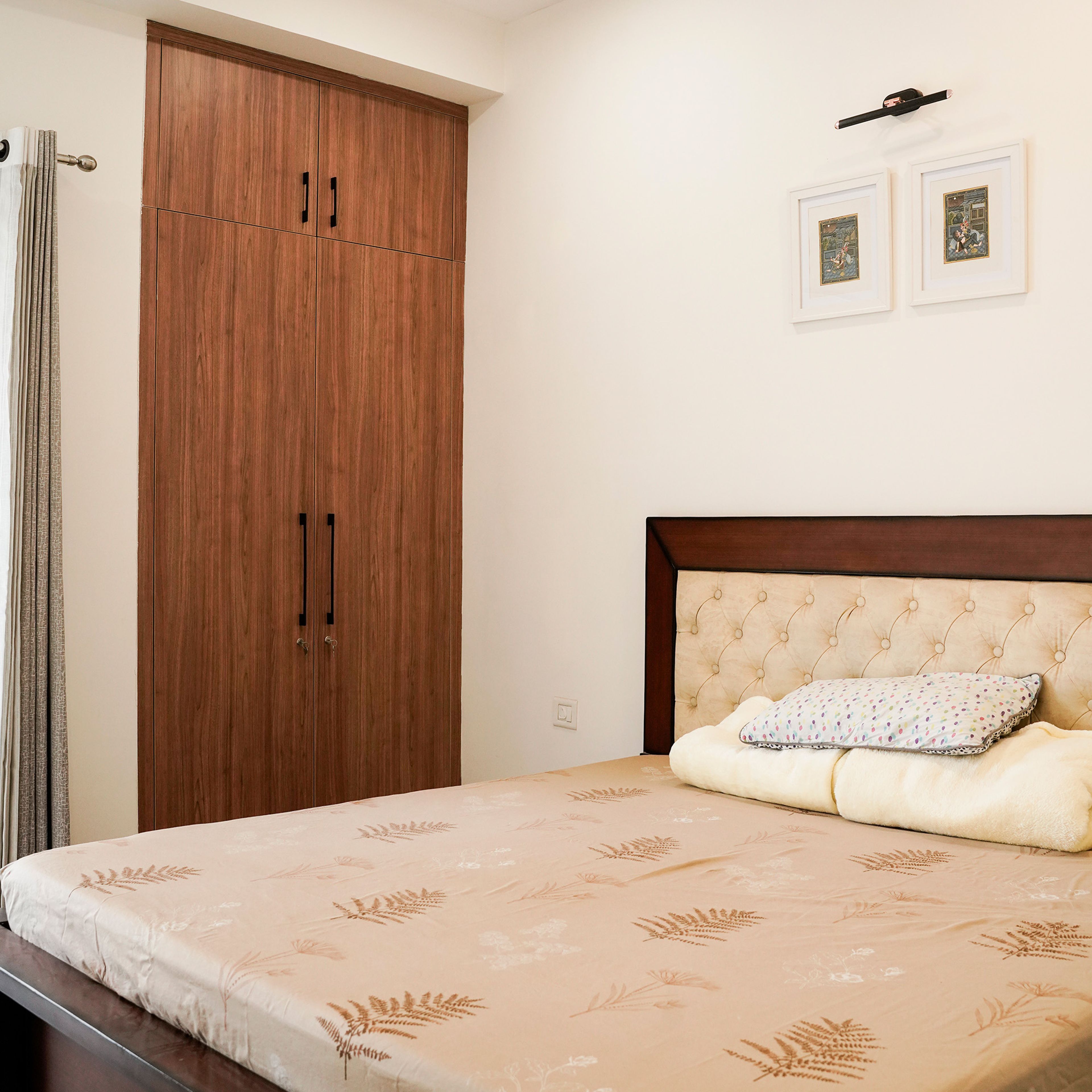 Bedroom Design with Tufted Headboard Bed and Wood-Finish Wardrobe