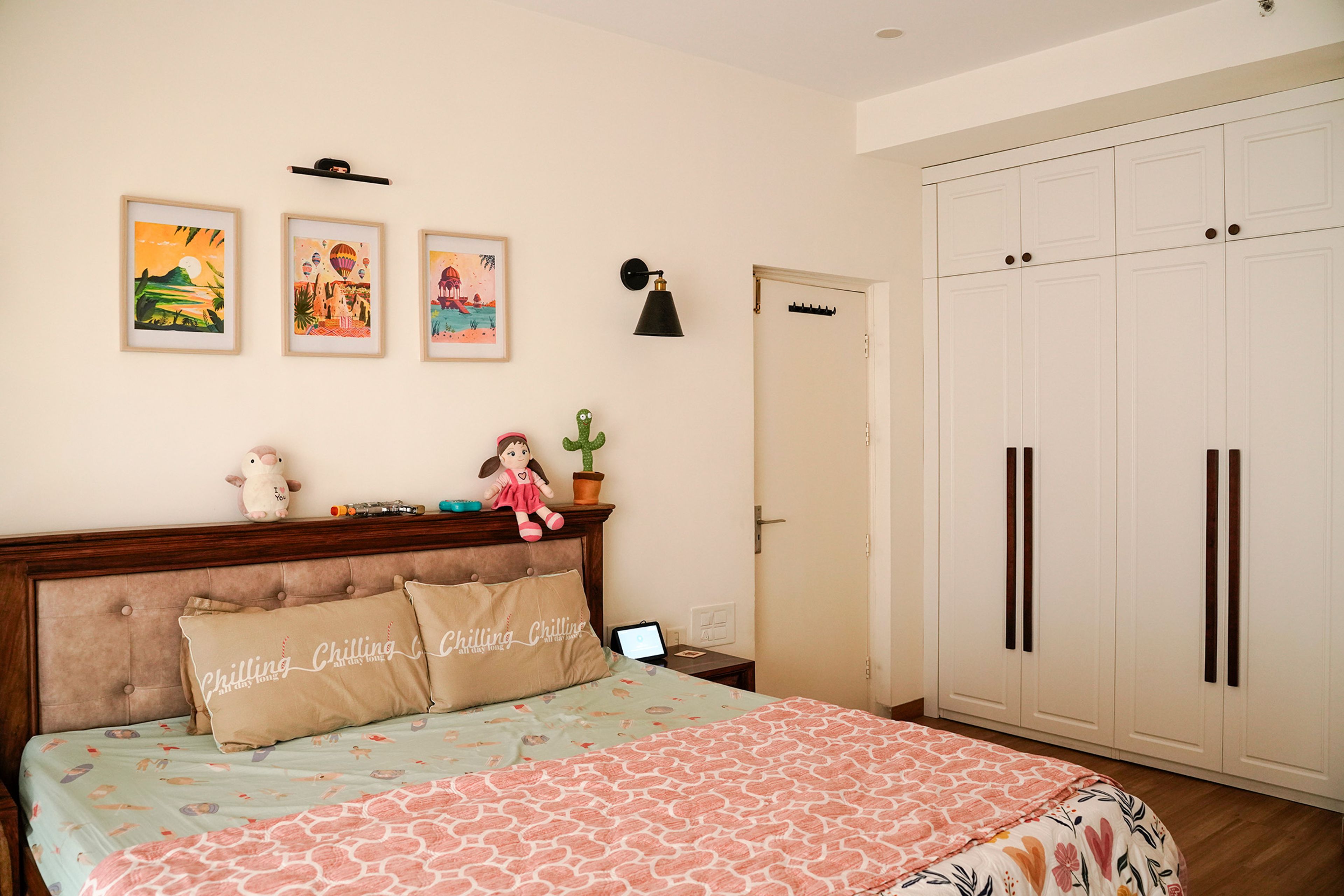 Bedroom Design with Padded Headboard and White 4-Door Swing Wardrobes