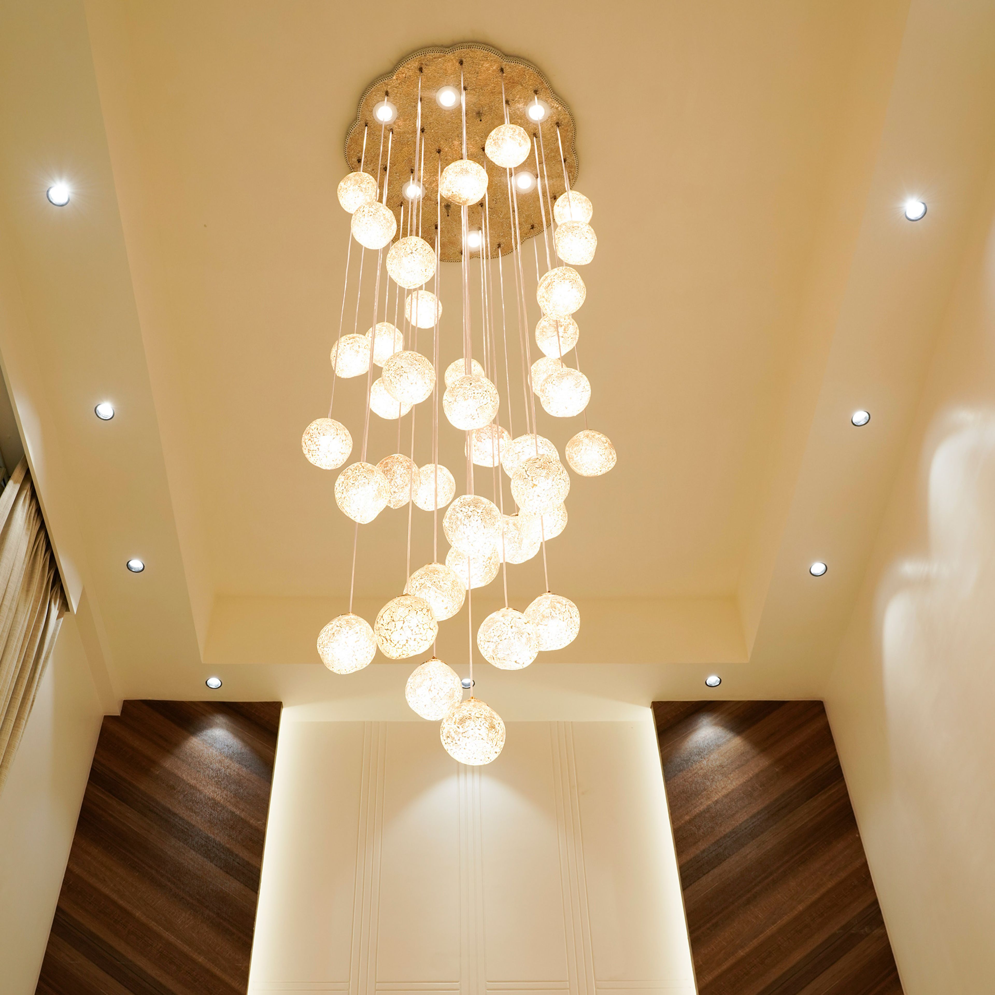 False ceiling design with hanging chandelier