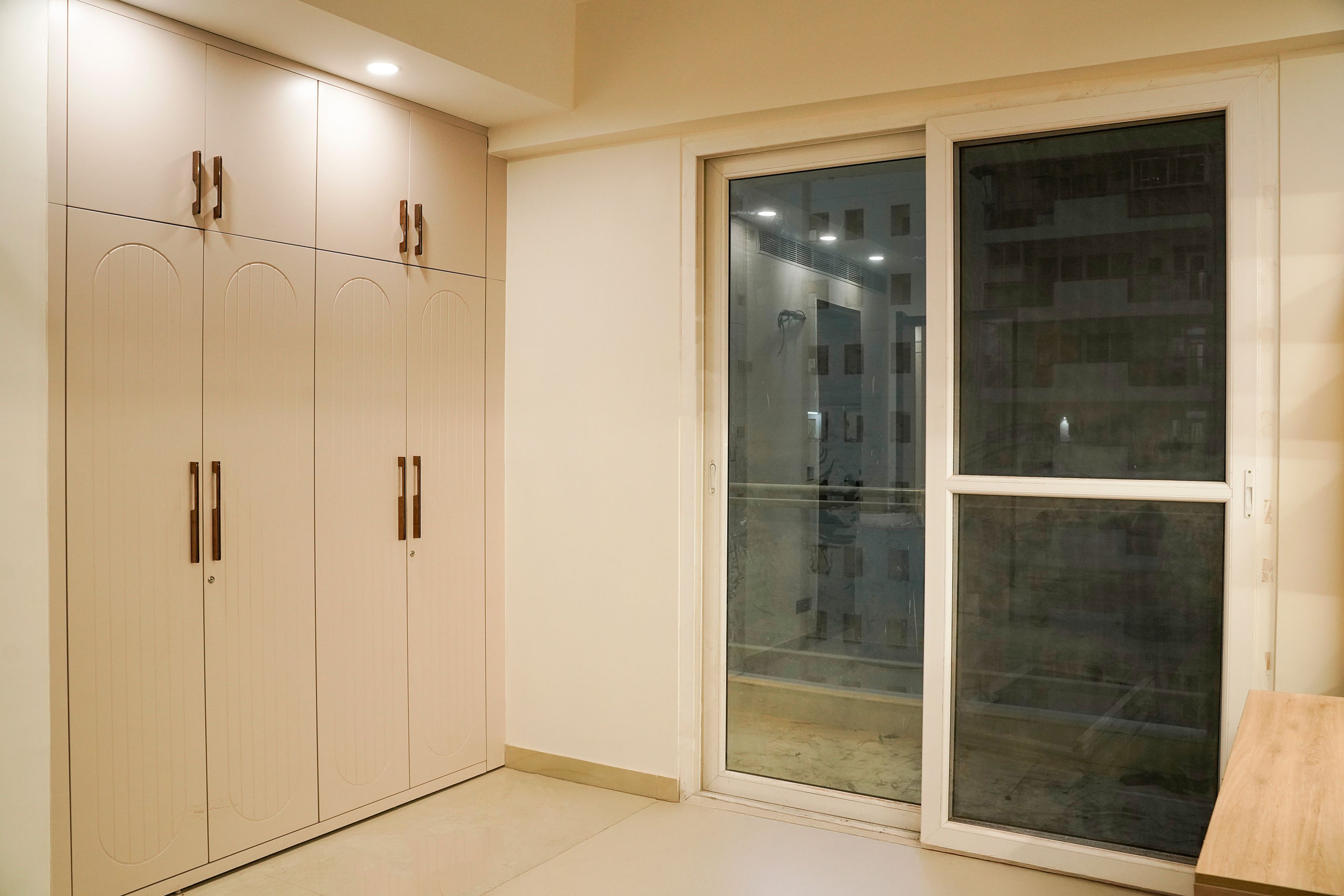 4-Door Beige Swing Wardrobe Design with Loft Unit