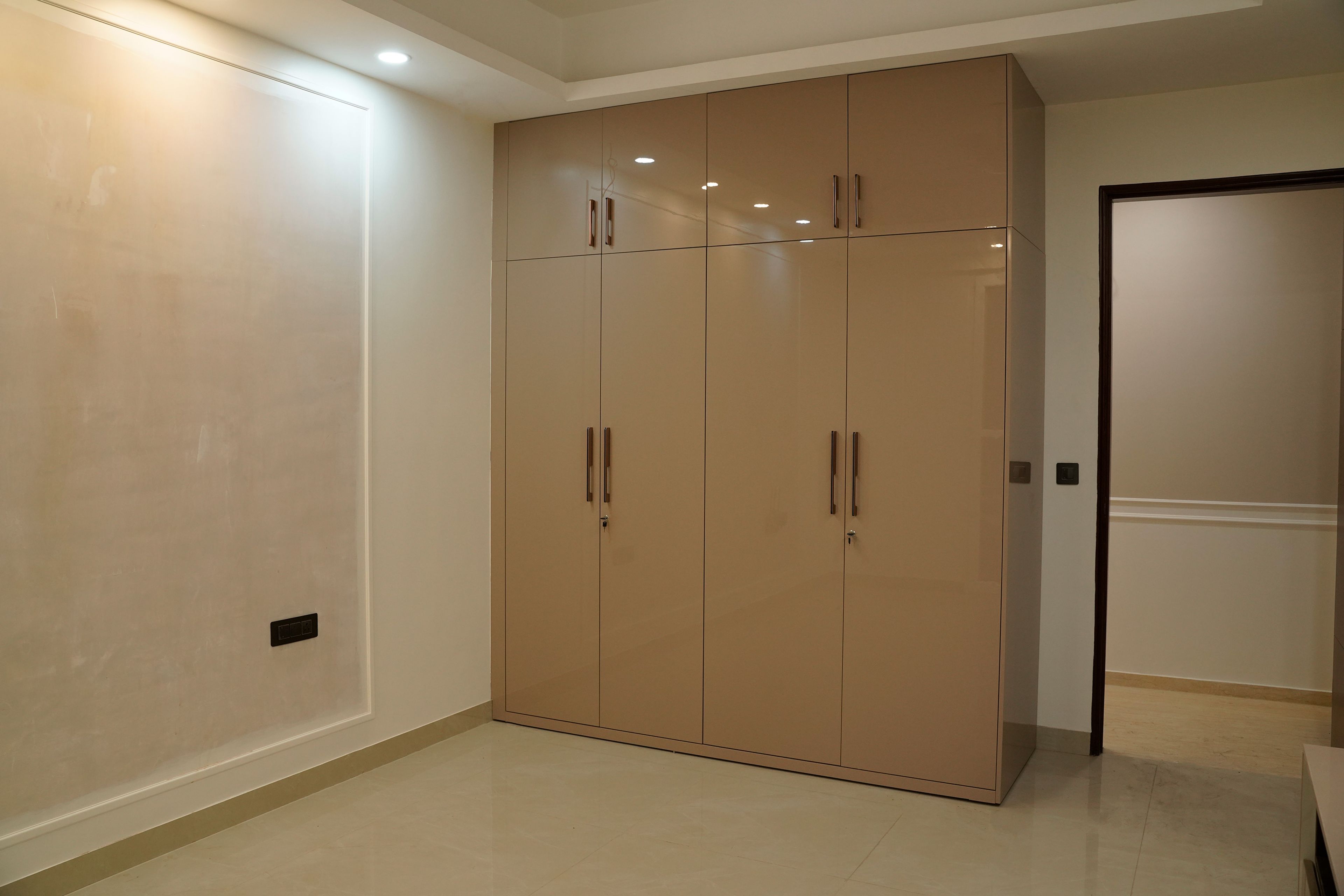 4-door light brown swing wardrobe design