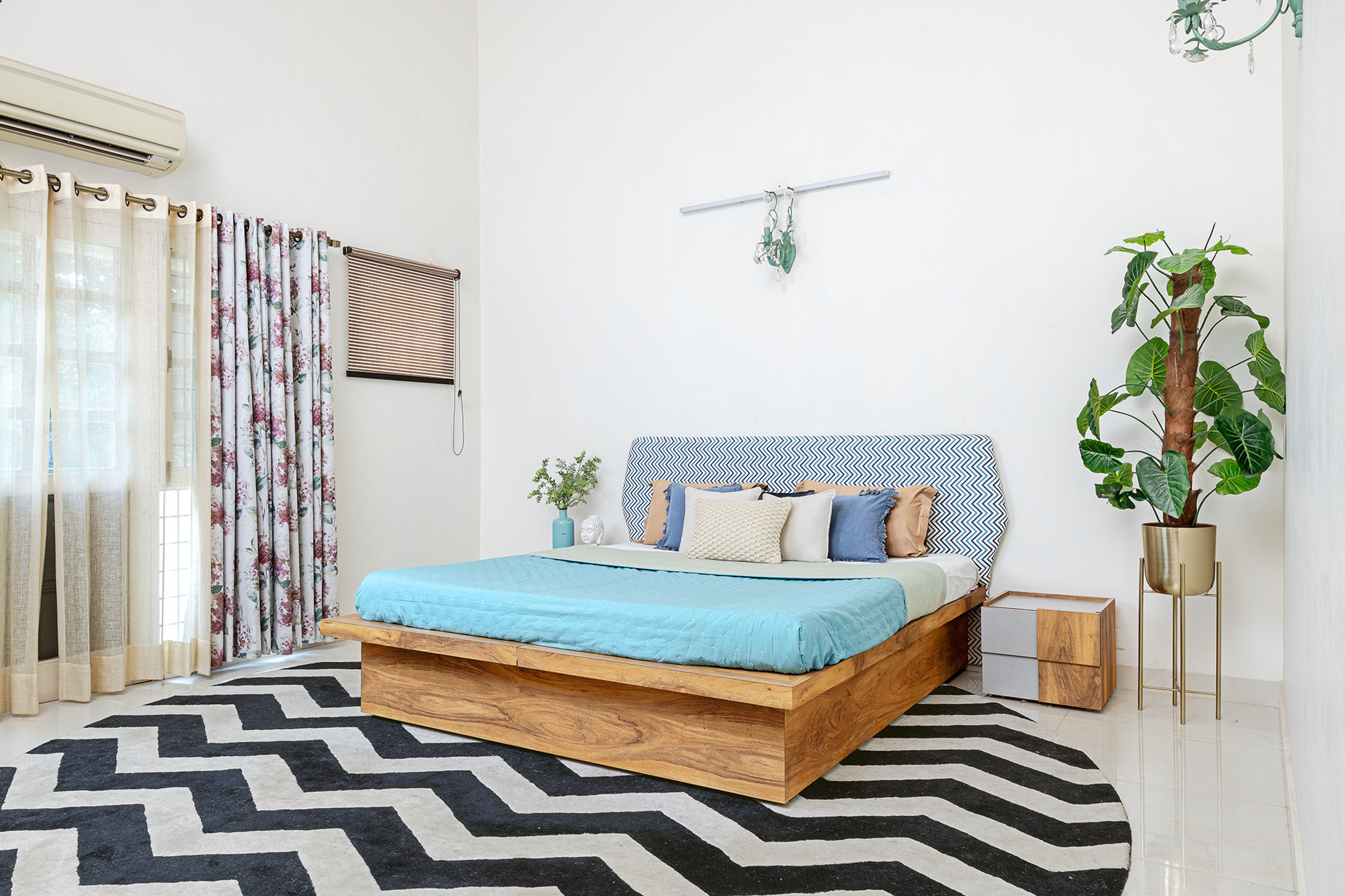 Bedroom Design with Printed Upholstered Headboard Bed and Black and White Rug