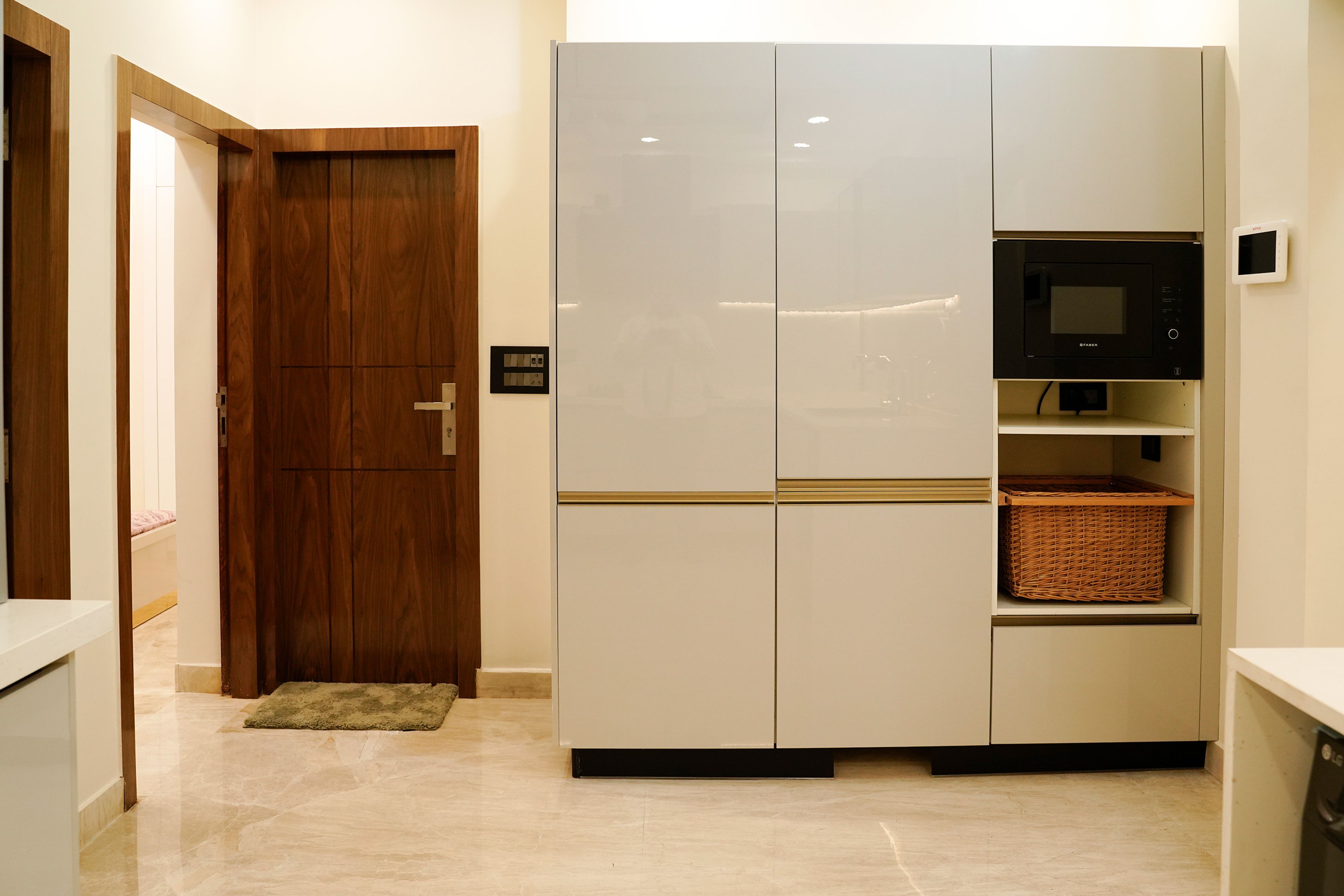 U-Shaped Kitchen Design with Grey Tall Units and Wicker Basket