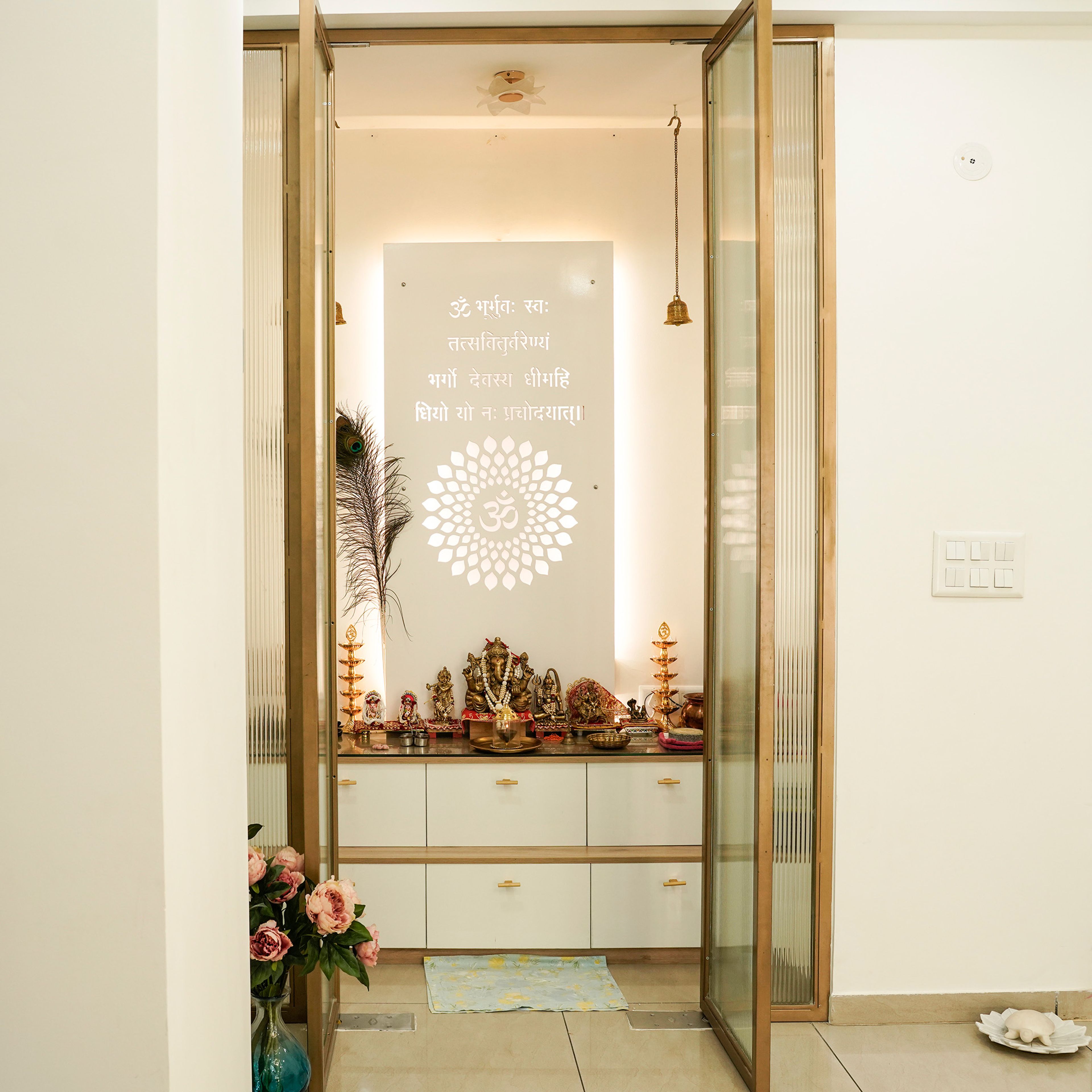 Pooja Unit Design with Om Engraved Background and Frosted Doors