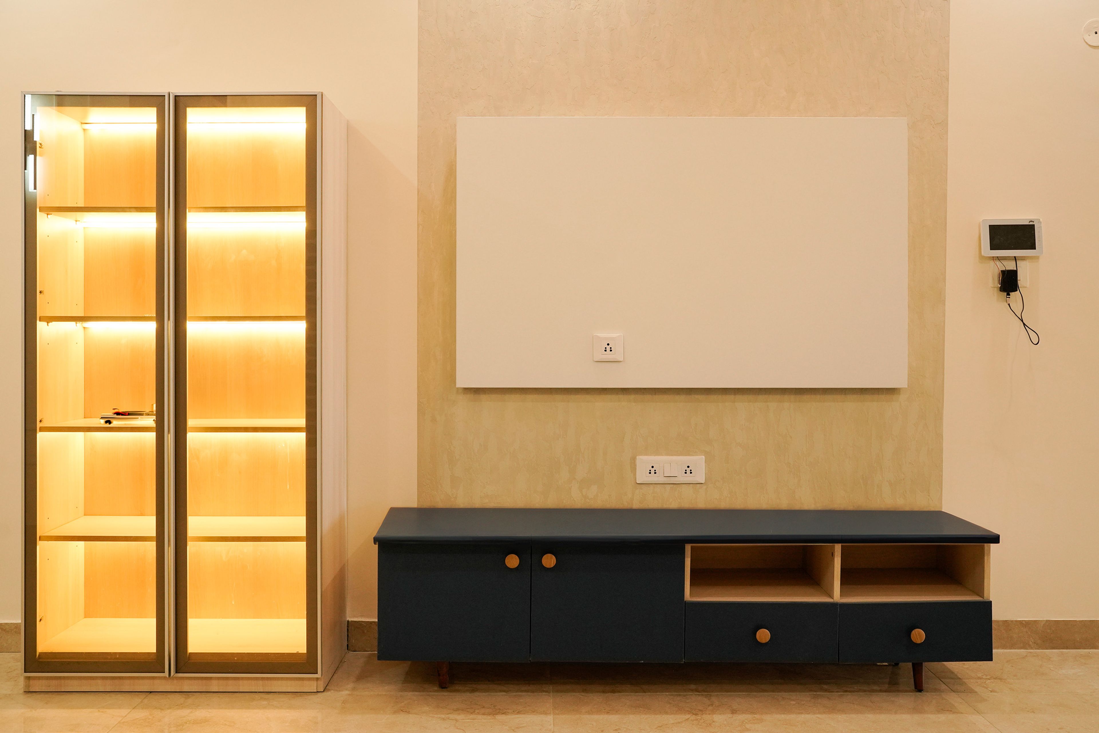 TV Unit Design with Teal Drawers and Tall Unit with Inside Lighting