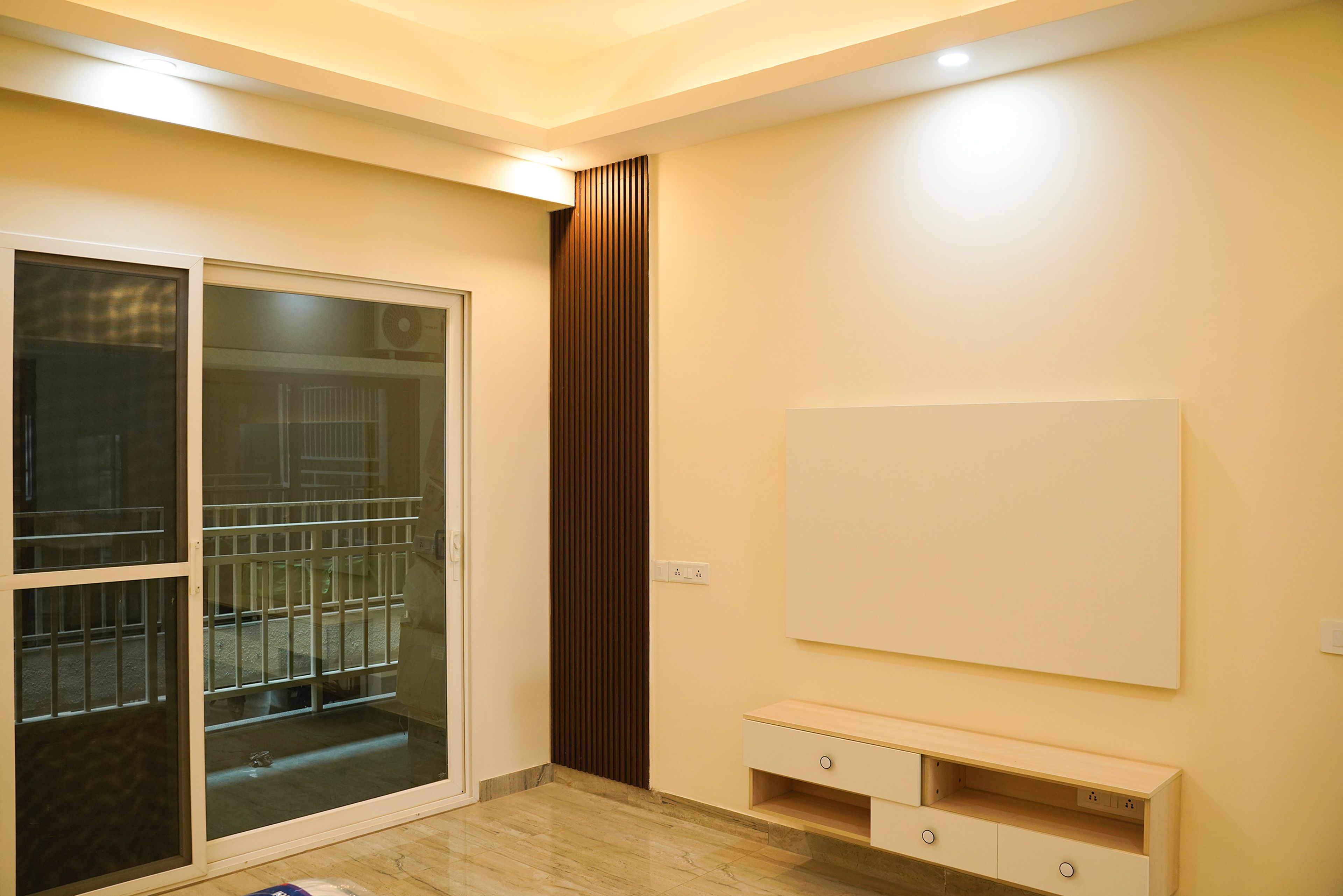 White TV Unit Design with Browed Fluted Wall Panels