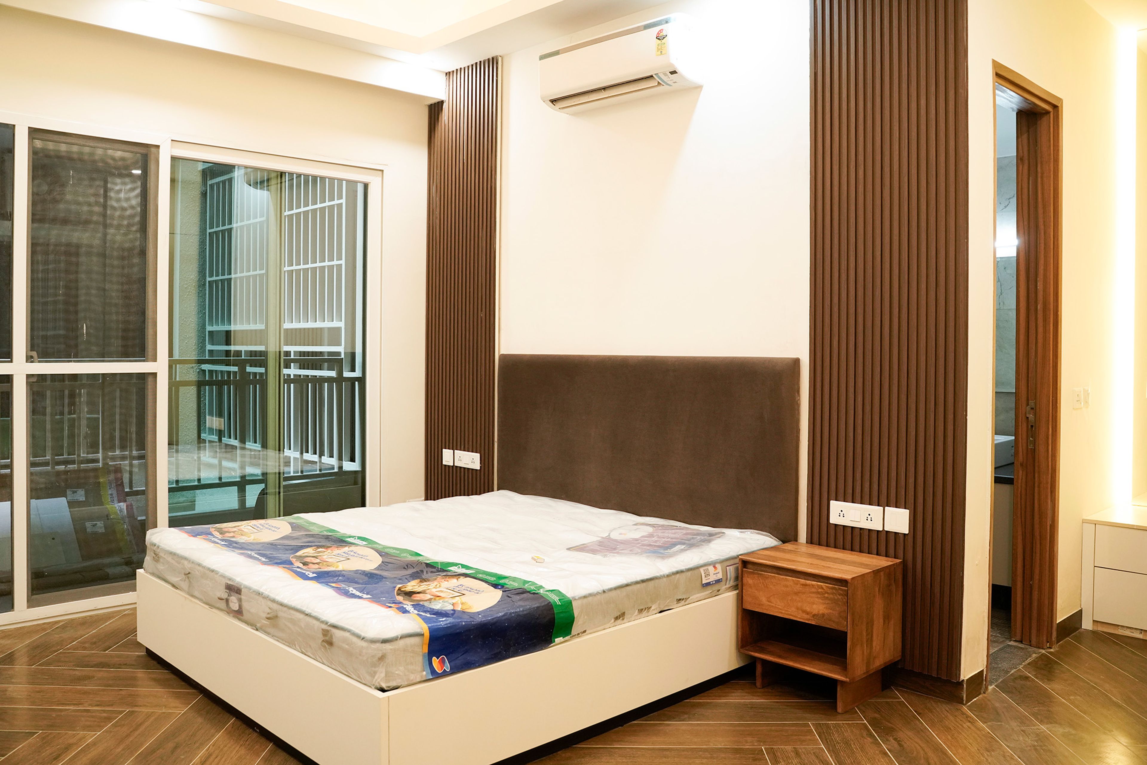 Bedroom Design with Brown Tufted Headboard Bed and Fluted Wall Panels