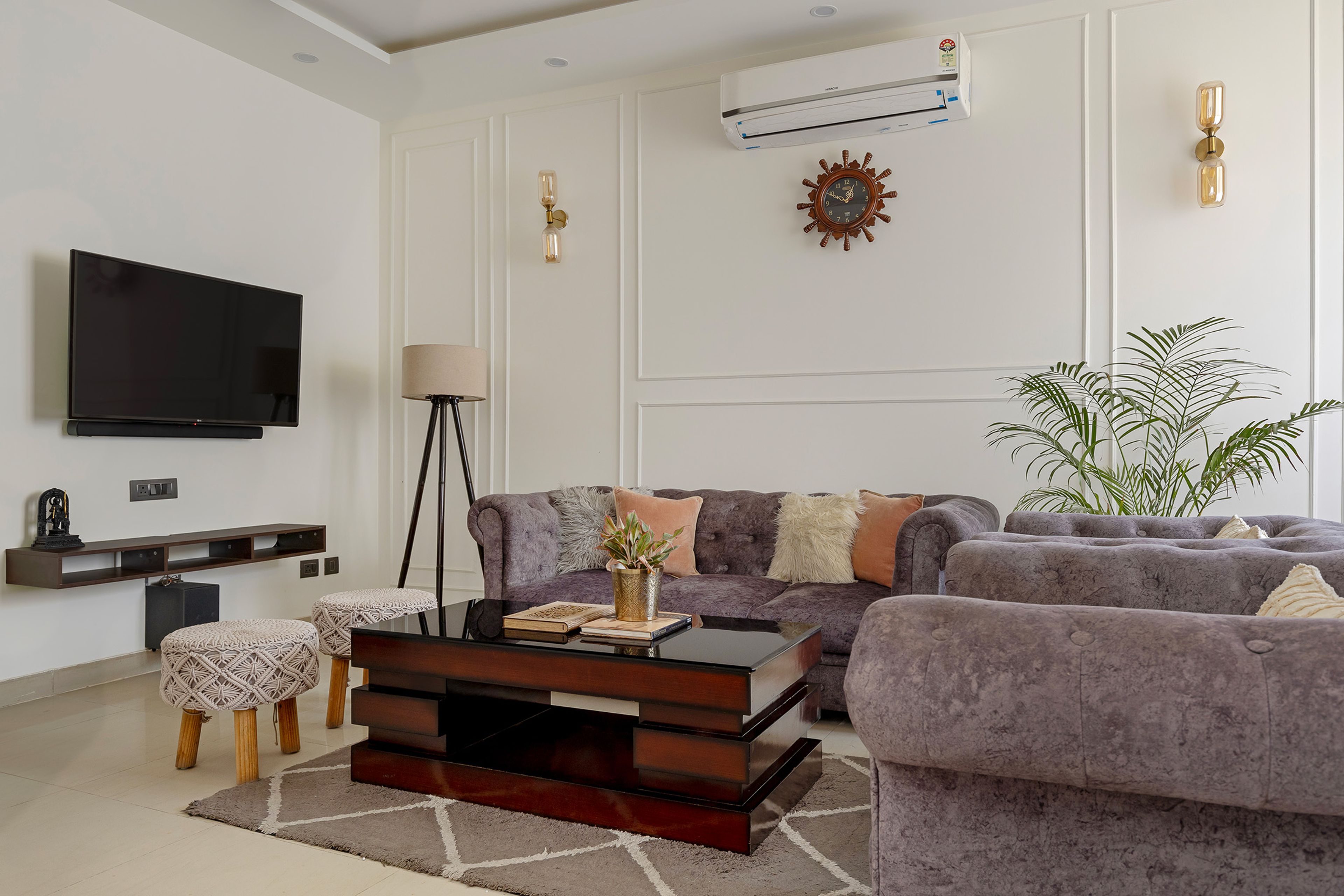 Living Room Design with Grey Sofas, White Wall with Trims and TV Unit