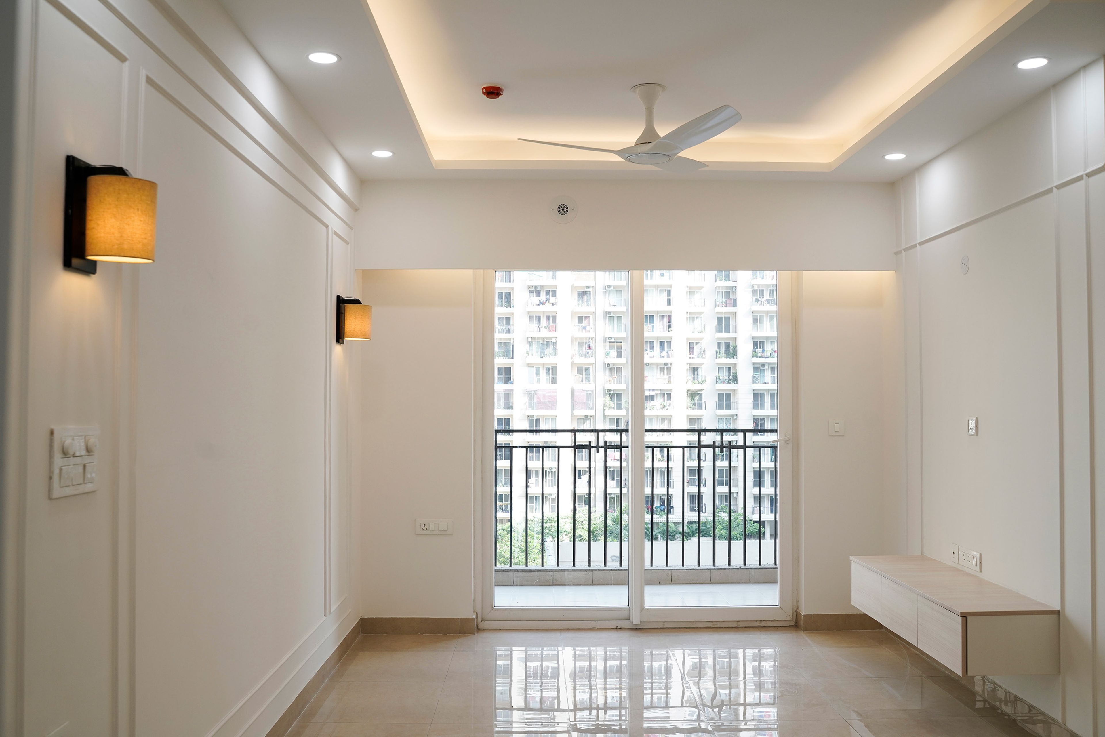 Living Room Design with Wall Mounted TV Unit and White Wall with Trims