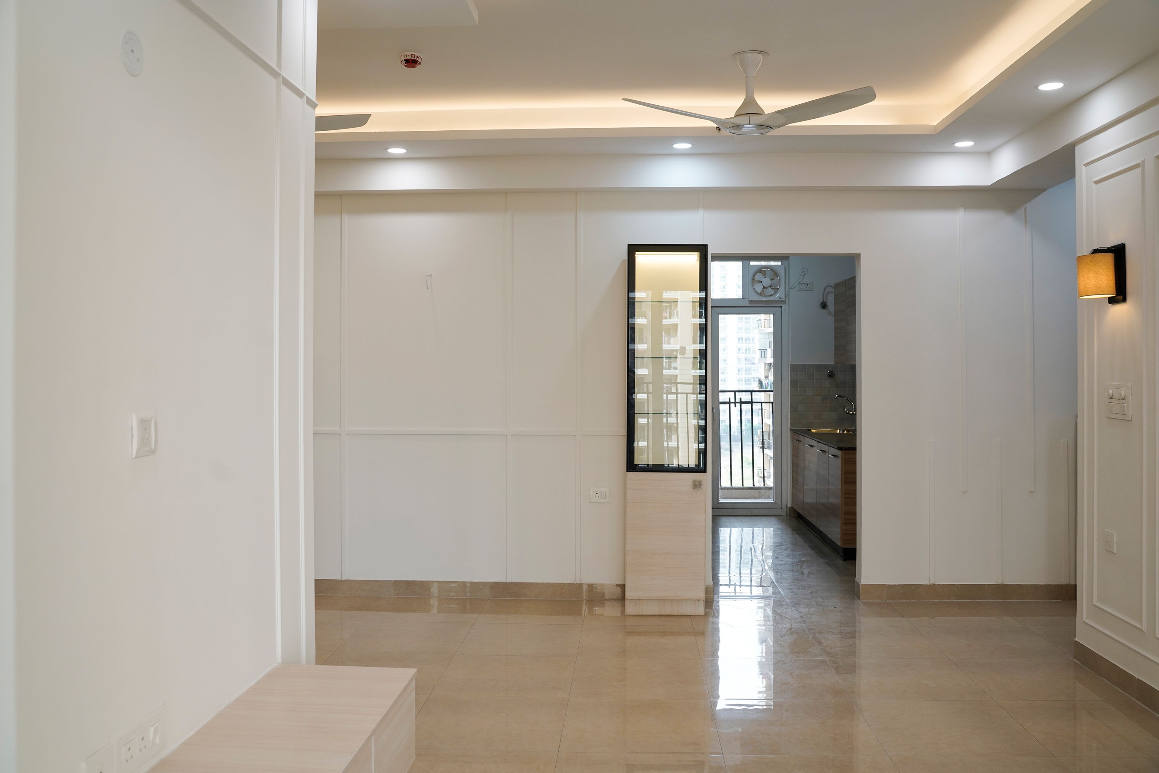 Living Room Design with Tall Glass Shutter Unit