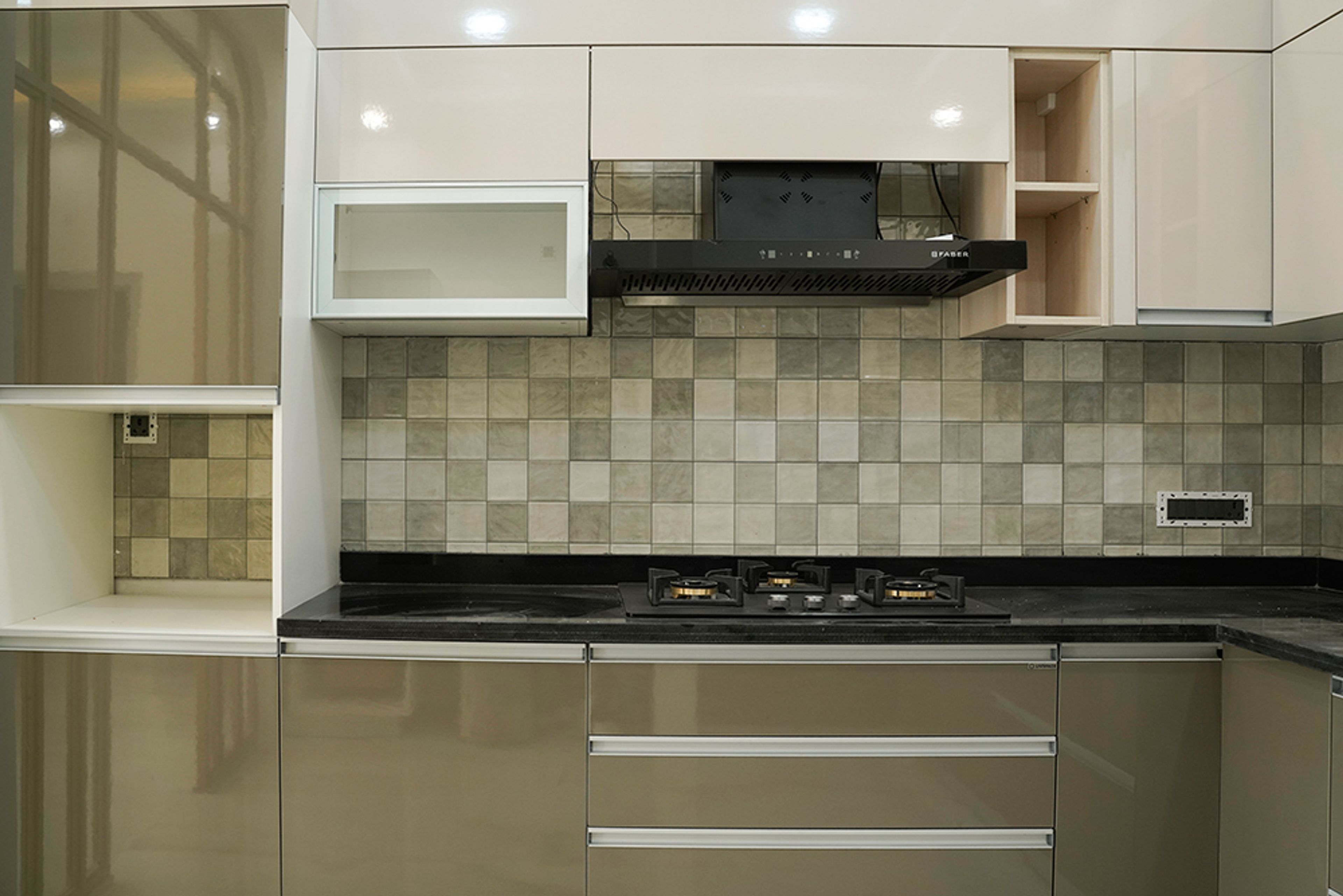 L-Shaped Kitchen Design with Black Granite Countertop and Grey Square Tiles Backsplash Wall