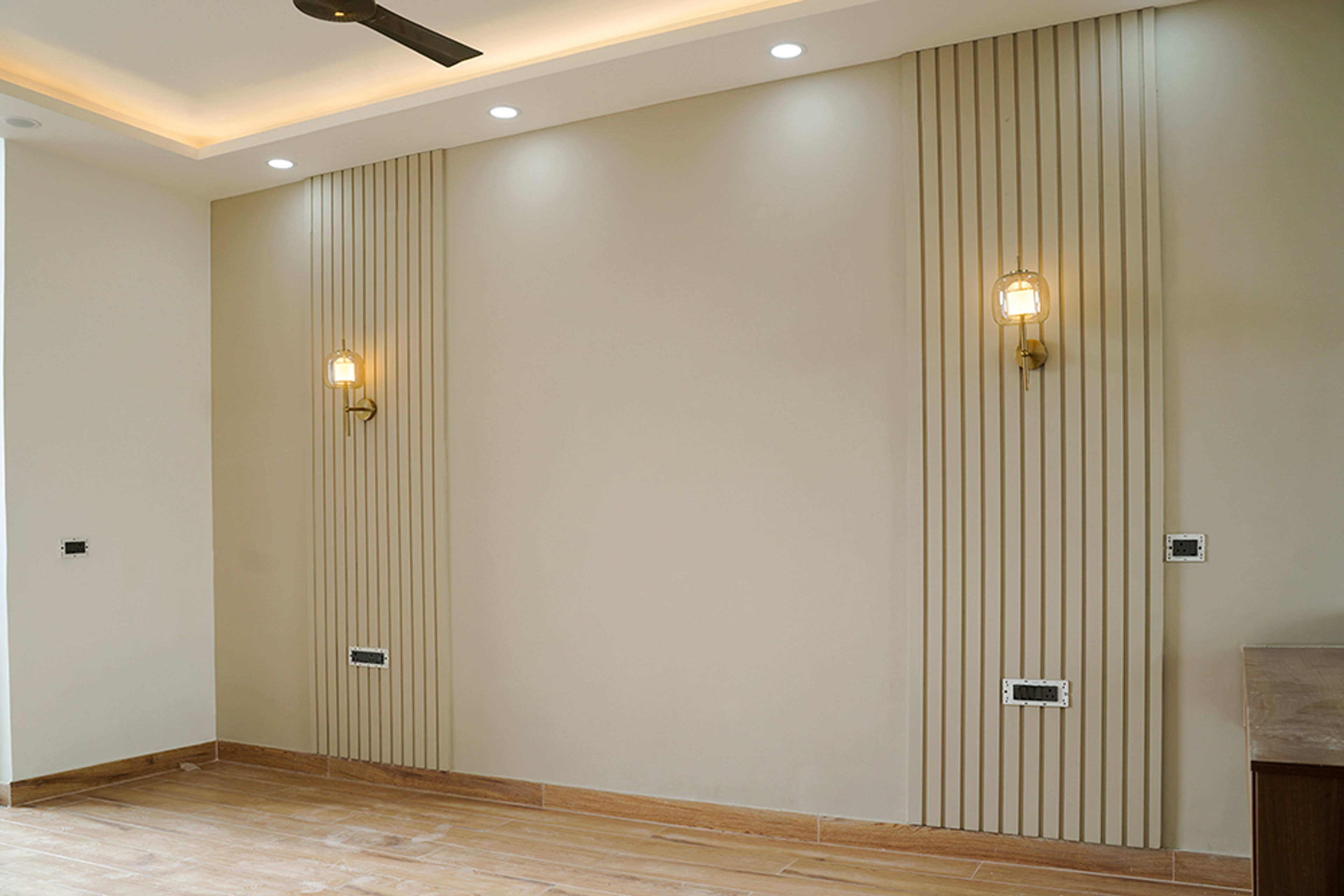Beige Wall Design with Grooves and Wall Lights