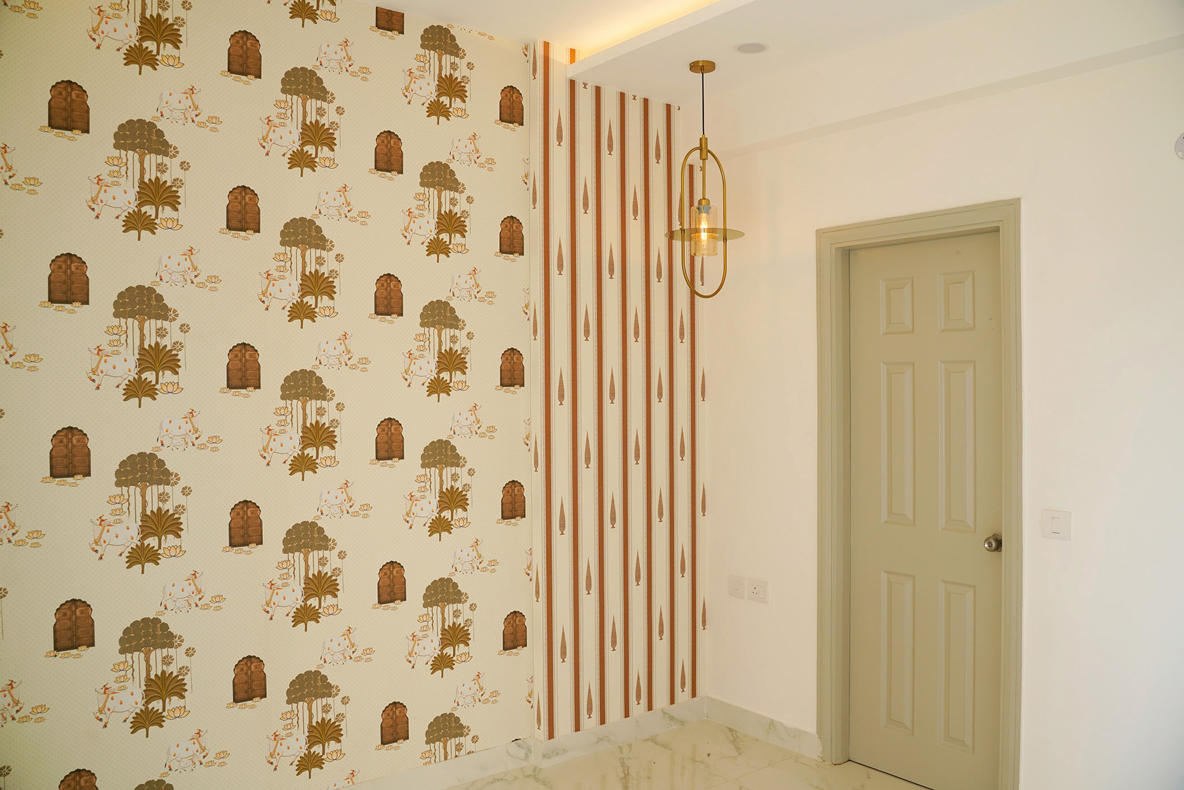 Wall Design with Ethnic Motif Wallpaper with Cows and Trees
