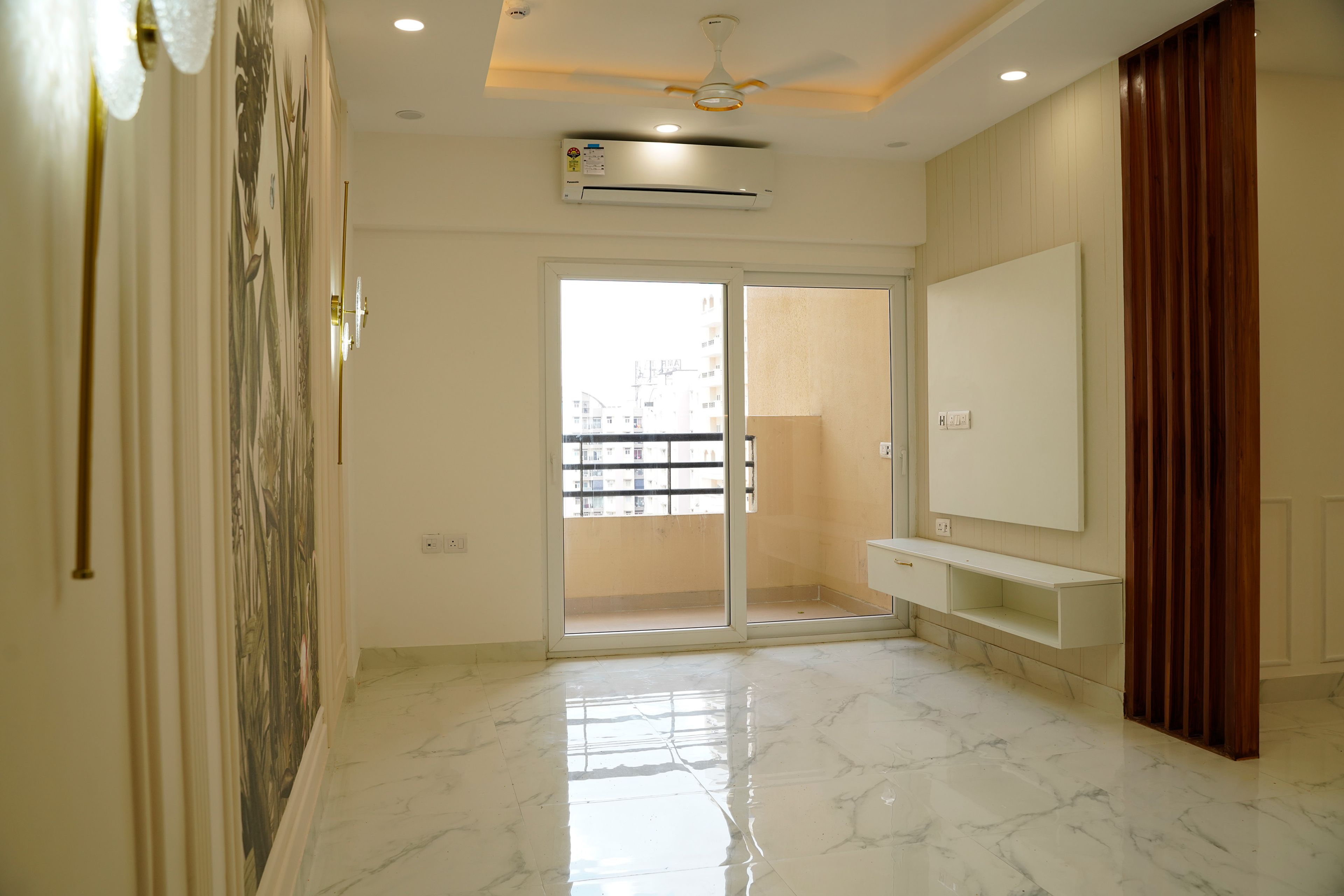 Living Room Design with White TV Unit and Tropical Themed Wall