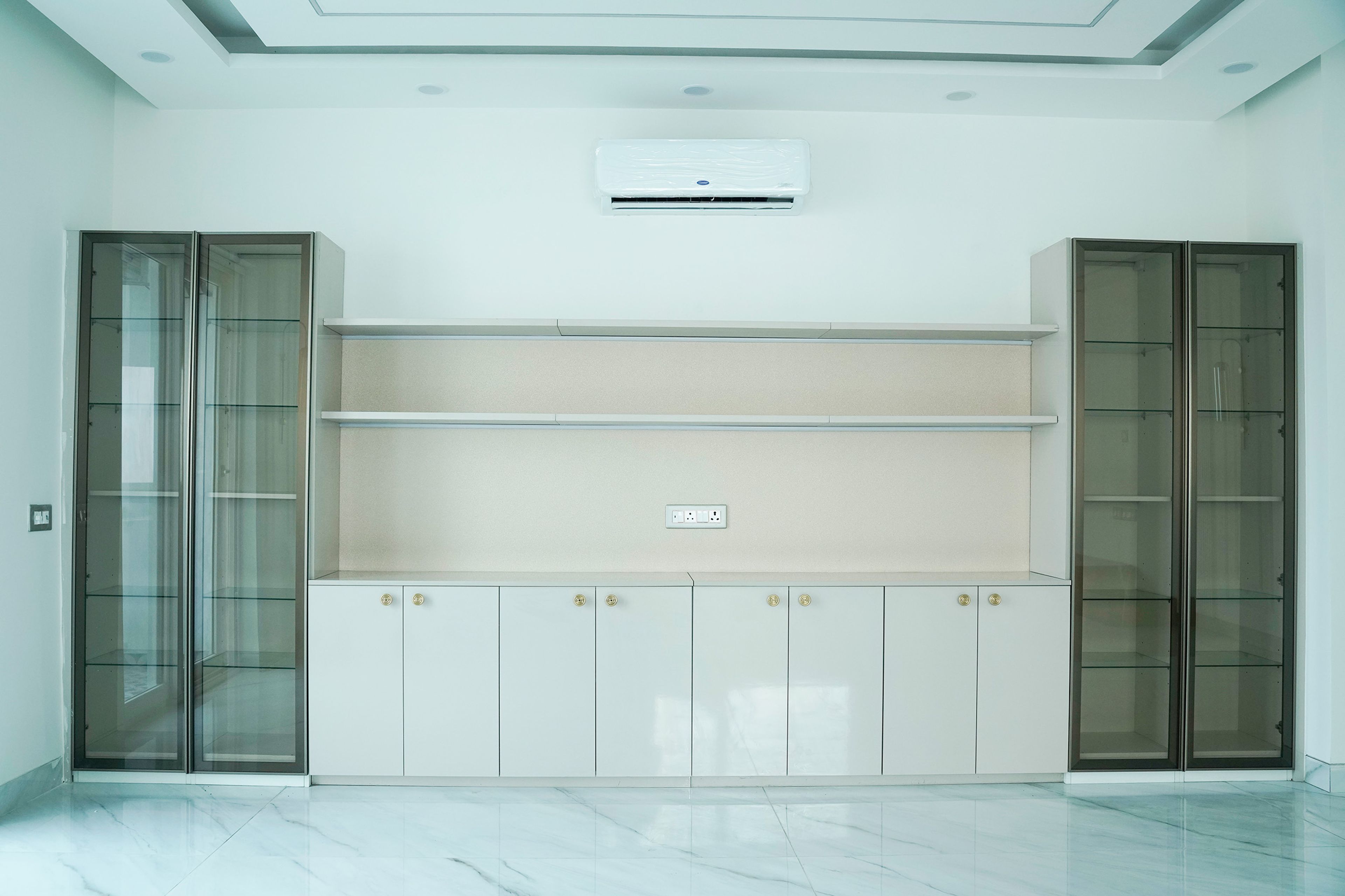 White Crockery Unit Design with Glass Shutter Tall Units on Both Sides