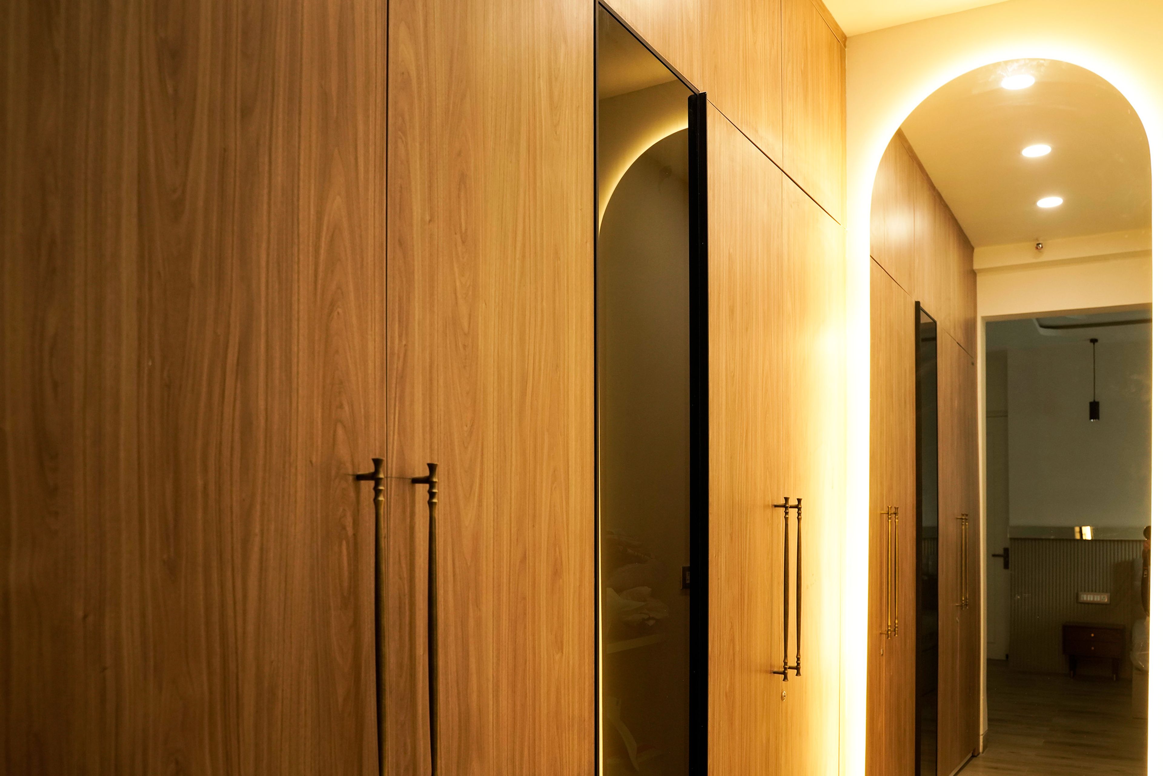 4-Door Wooden Swing Wardrobe Design and Cove Lit Oval Mirror