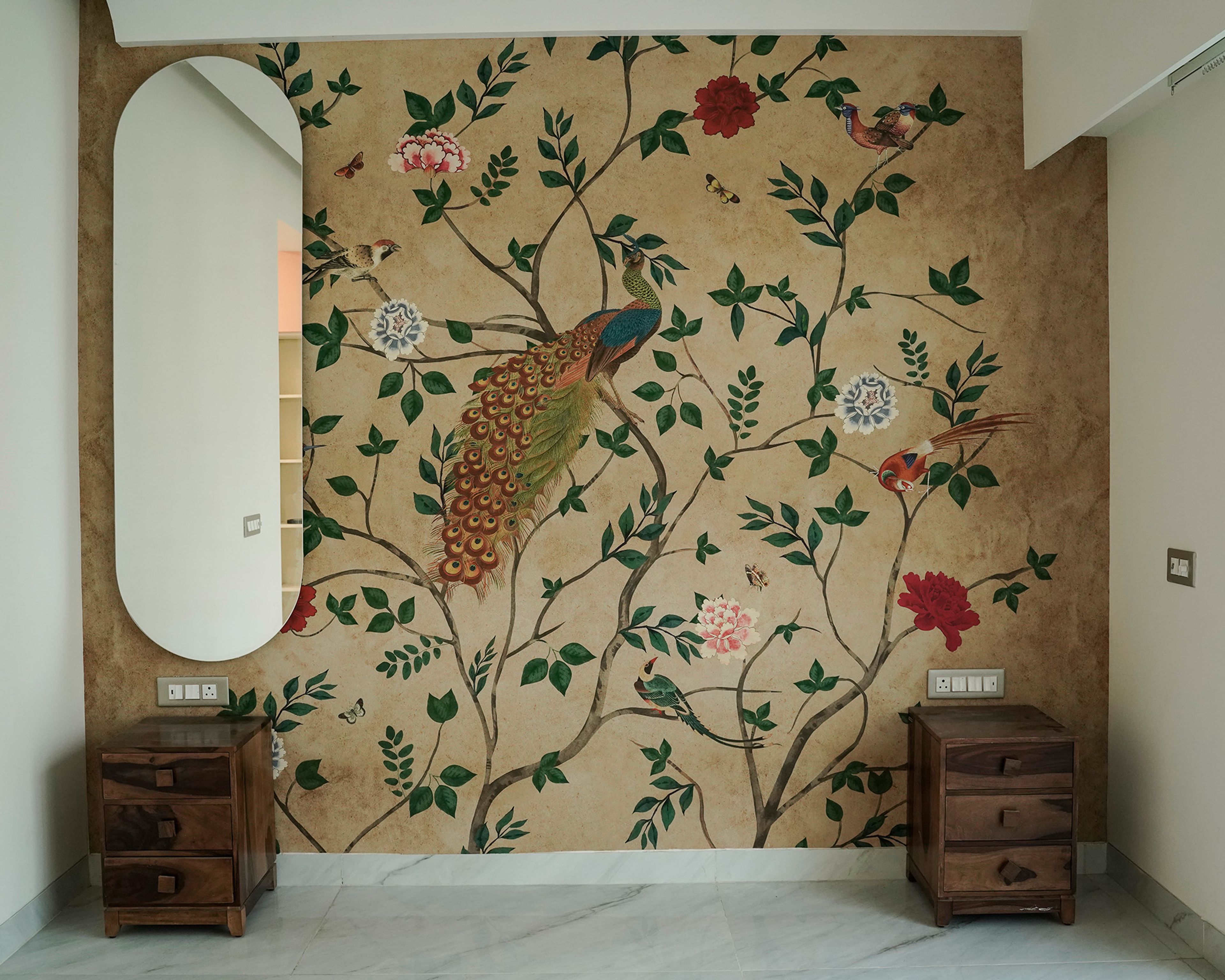 Bedroom Design with Hand-Painted Peacock Botanical Wall Mural, Oval Wall Mirror, and Wooden Bedside Units