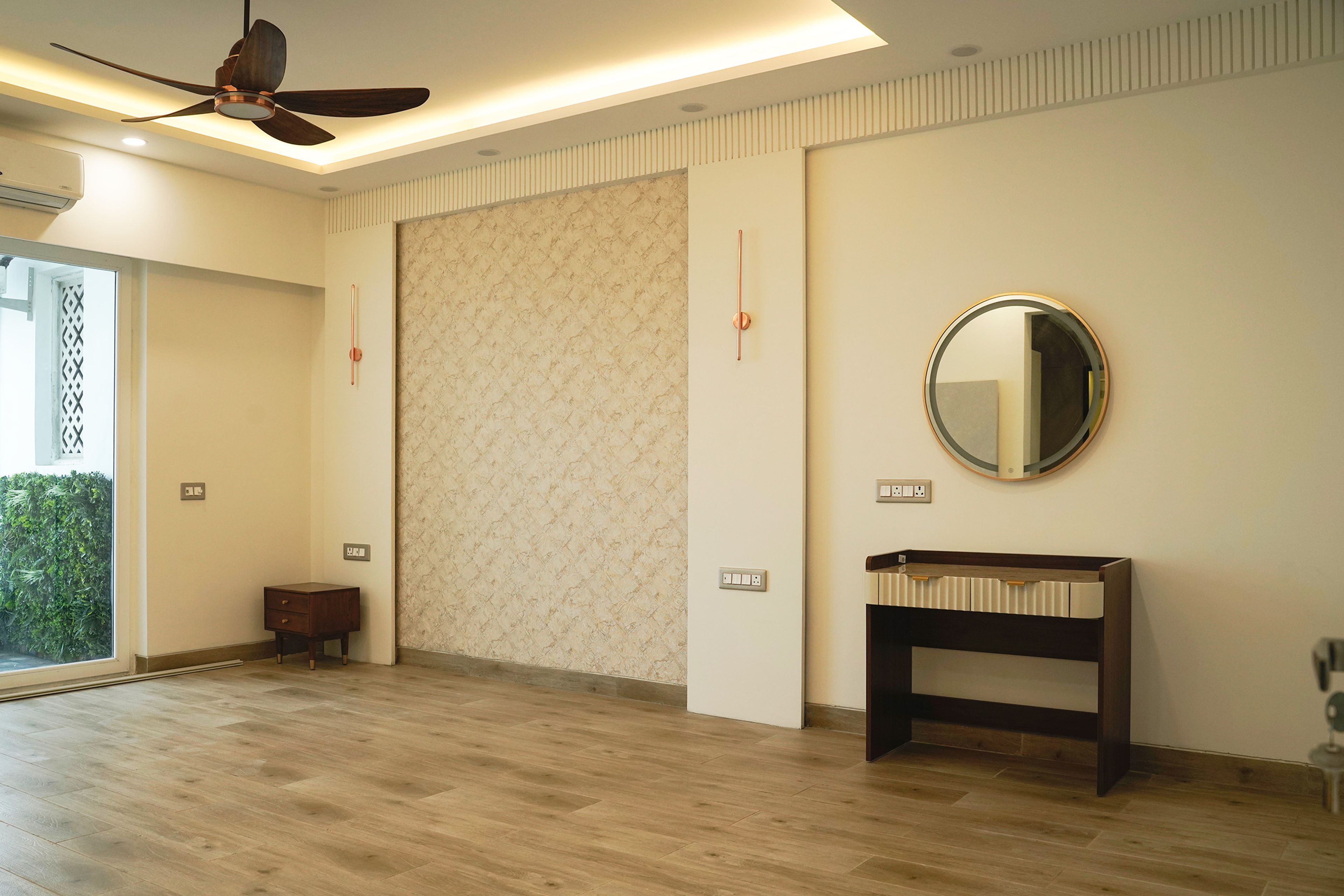 Bedroom Design with Textured Accent Wall Panel, Floating Vanity Console, and Modern False Ceiling