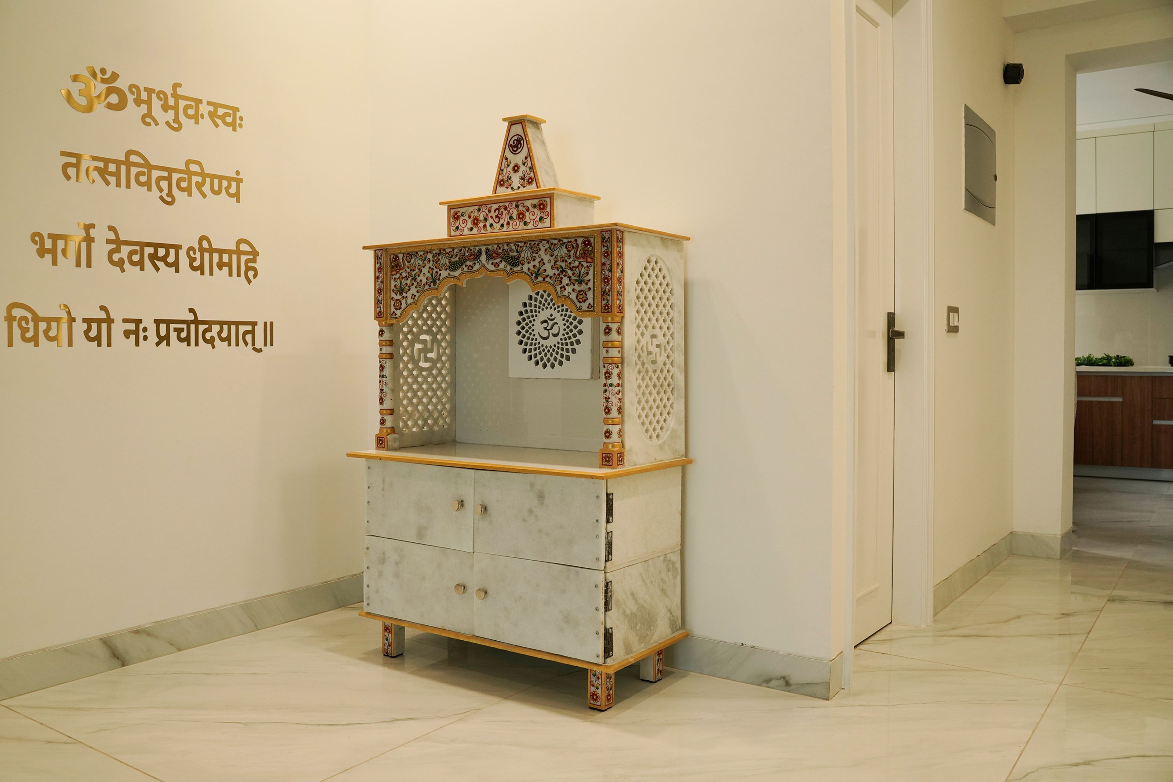 Pooja Unit with Intricate Carvings and Drawer and Golded Mantras on the Wall