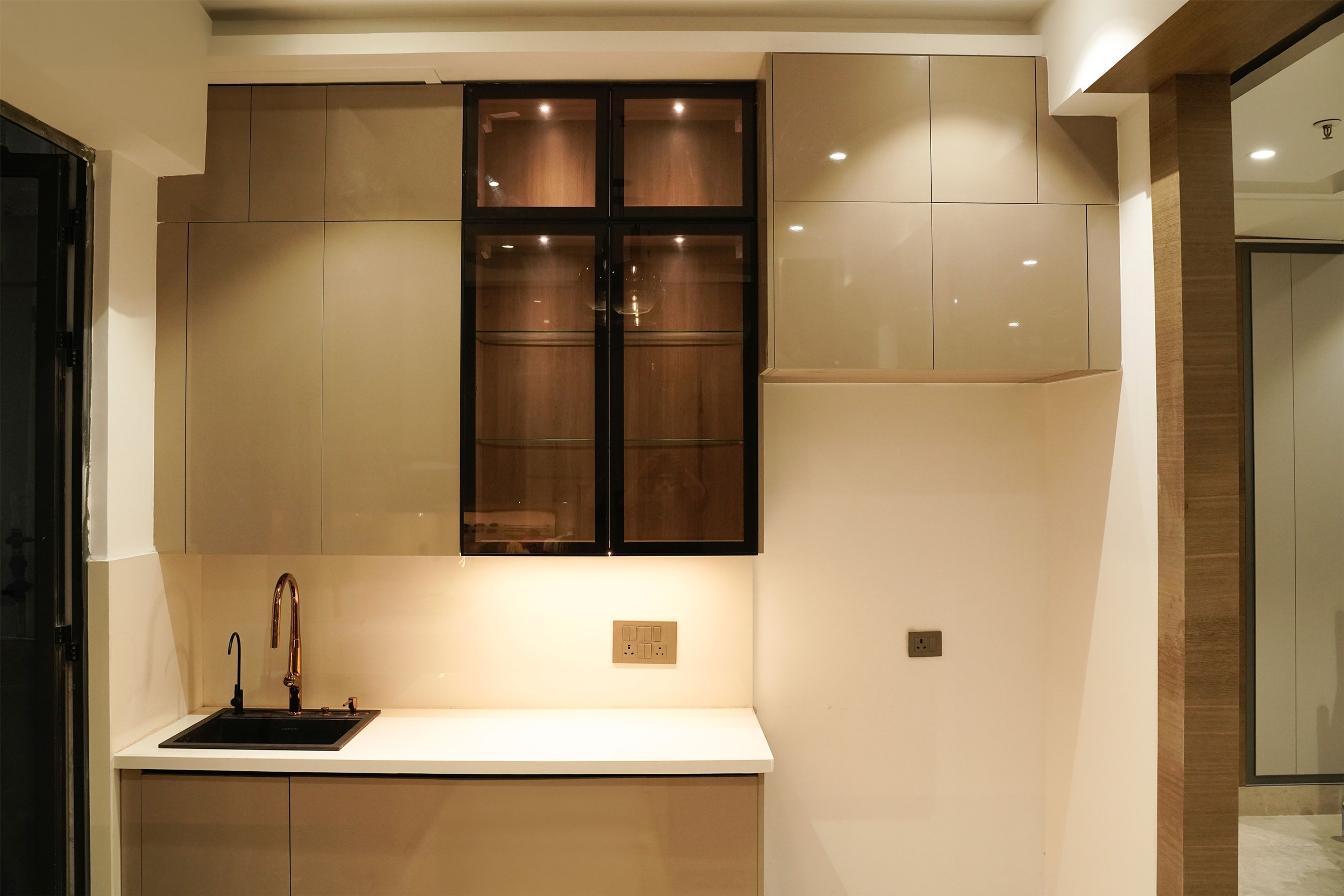 Island Kitchen Design with Beige and Black Glass Shutters Wall Unit