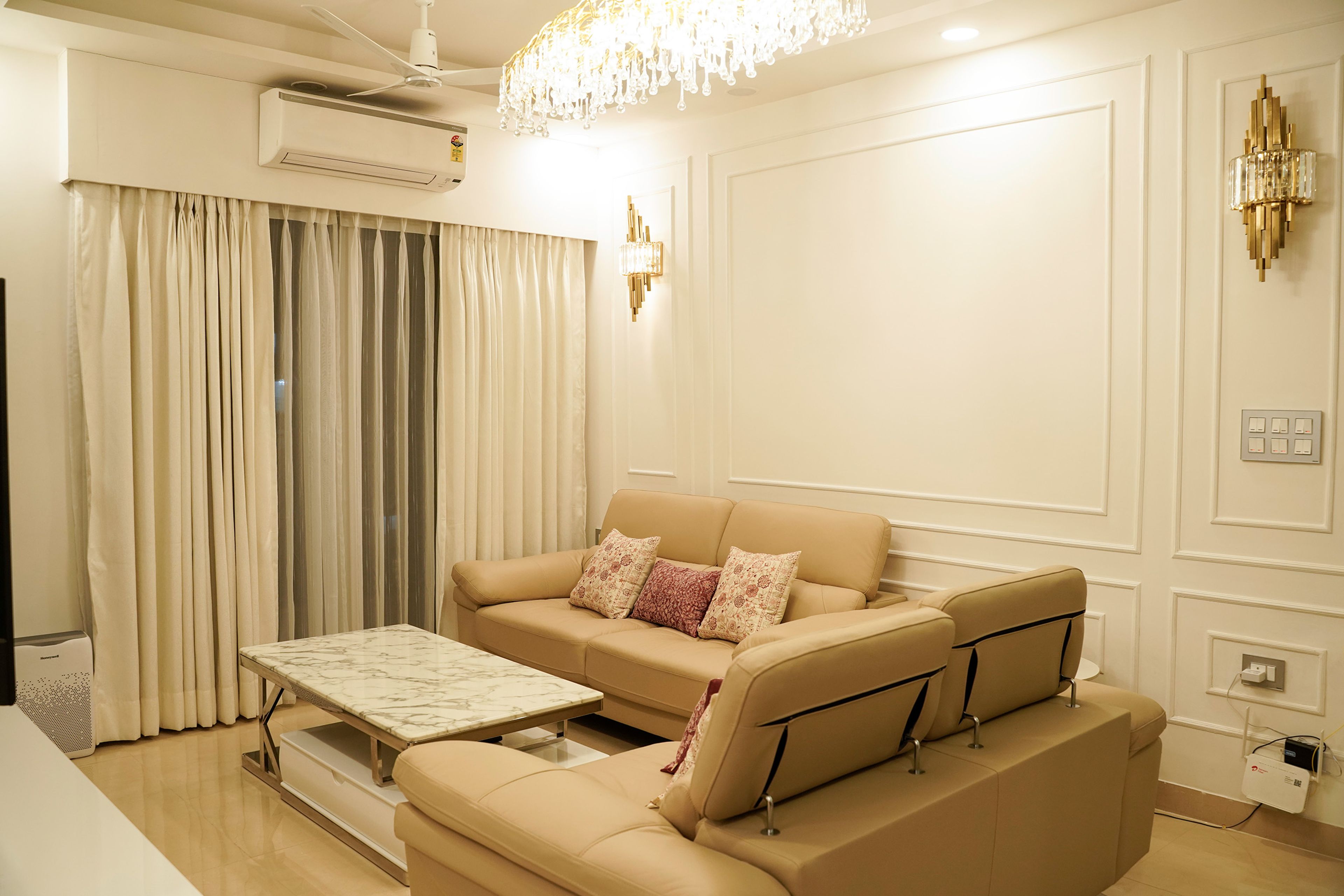 Living Room Design with Two Beige Sofas and White Wall with Trims