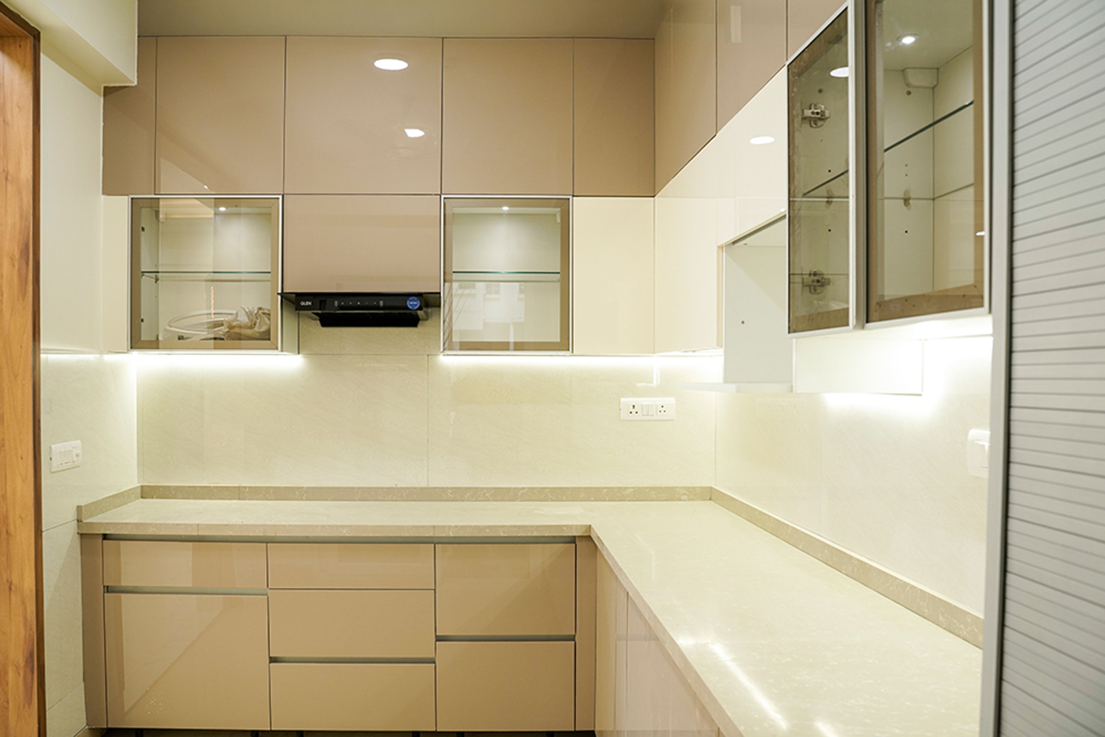 L-Shaped Kitchen Design with Cream Units and White Quartz Countertop