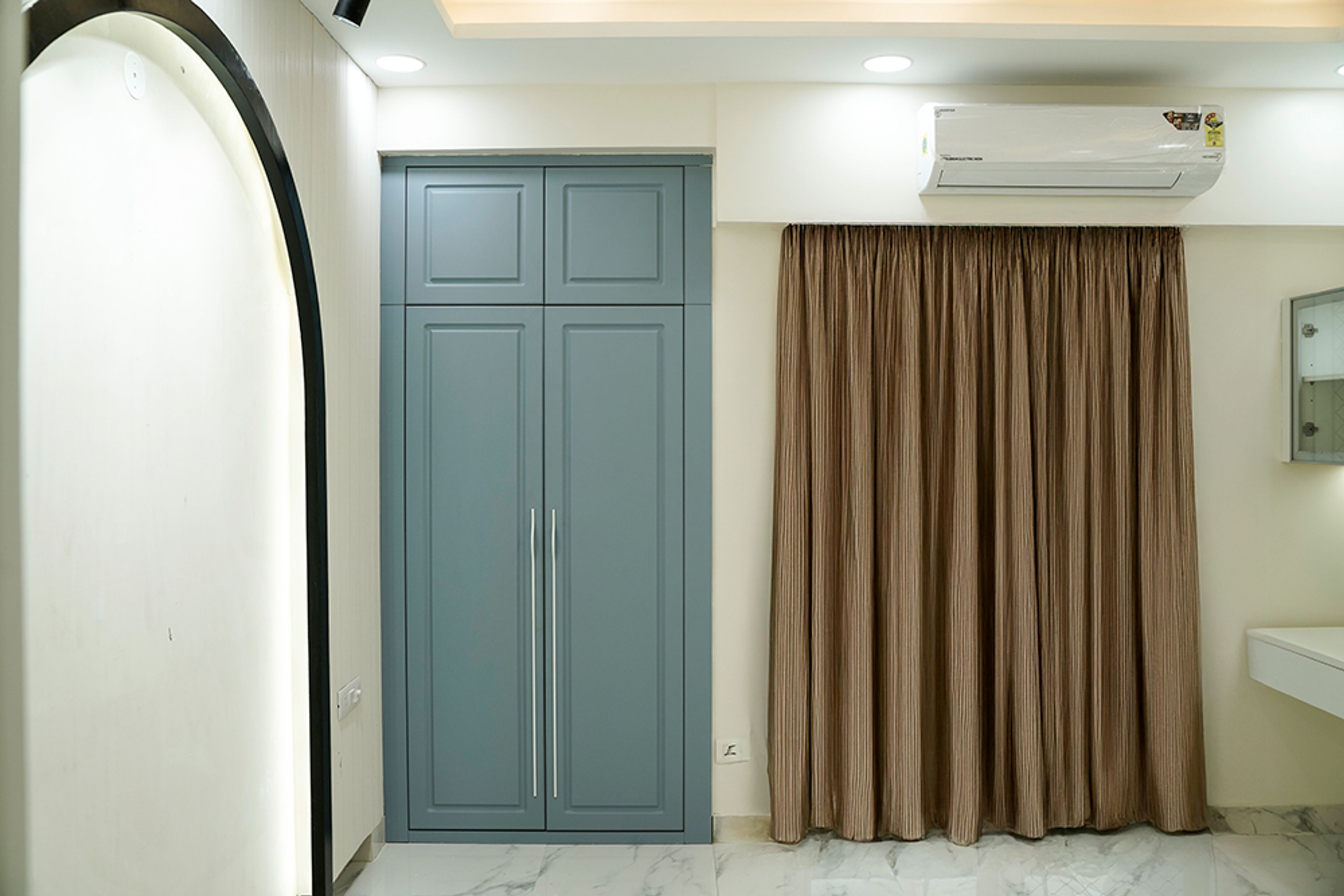 Bedroom Design with White and Black Arched Wall and 2-Door Blue Swing Wardrobe