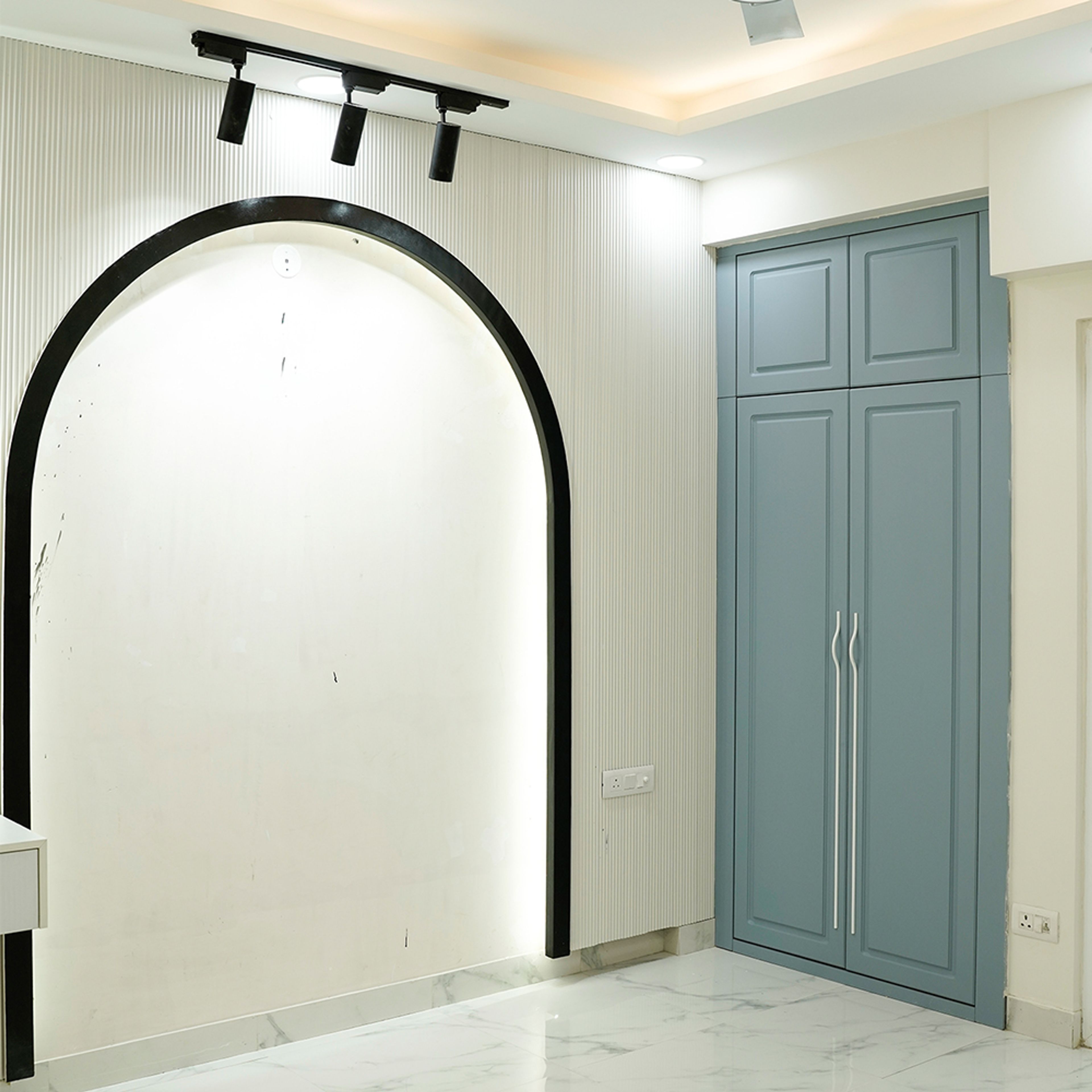 Bedroom Design with White and Black Arched Wall and 2-Door Blue Swing Wardrobe