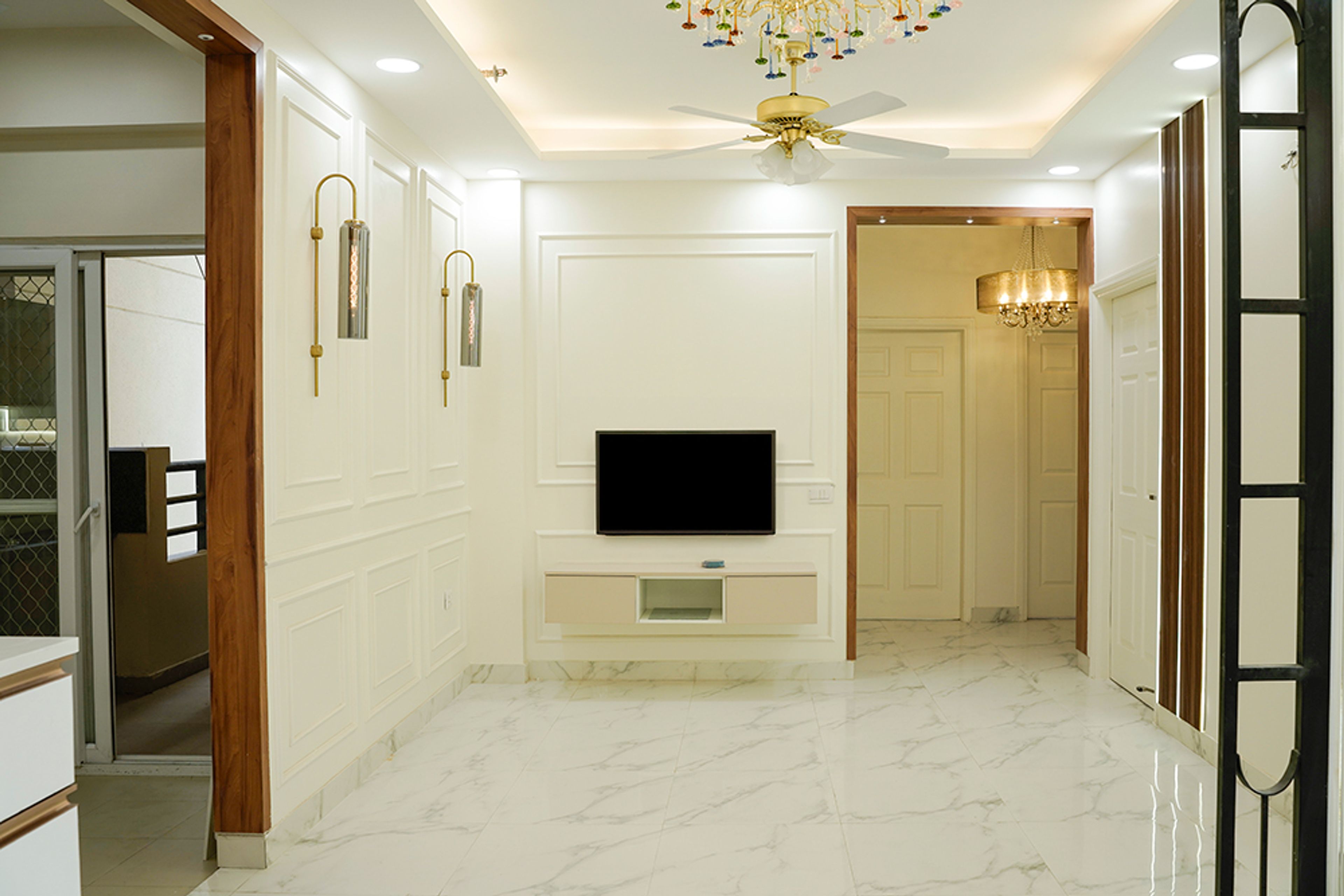 Living Room Design with TV Unit with White Walls with Trims and Beige Drawers