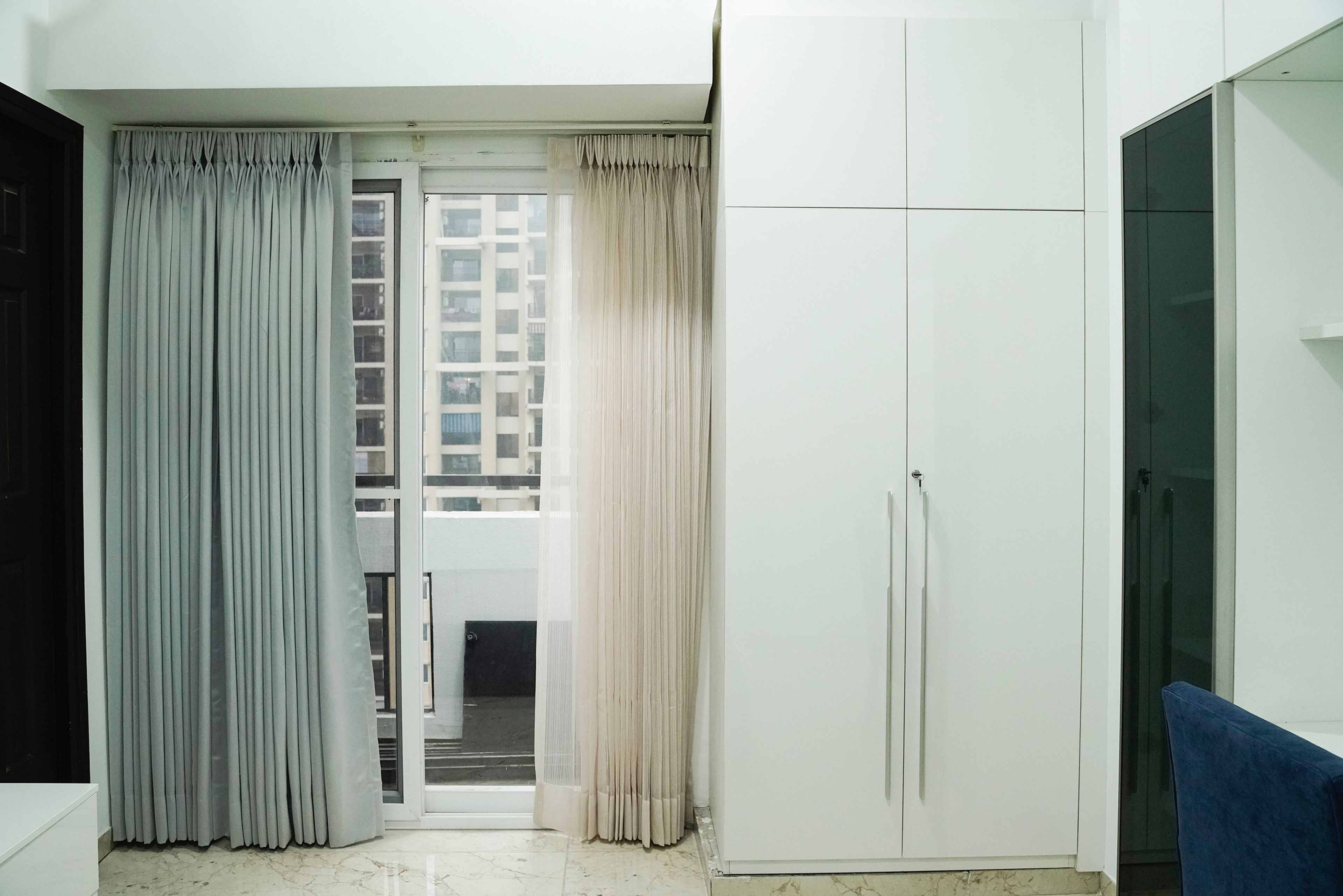 2-Door White Swing Wardrobe Design with Loft Unit