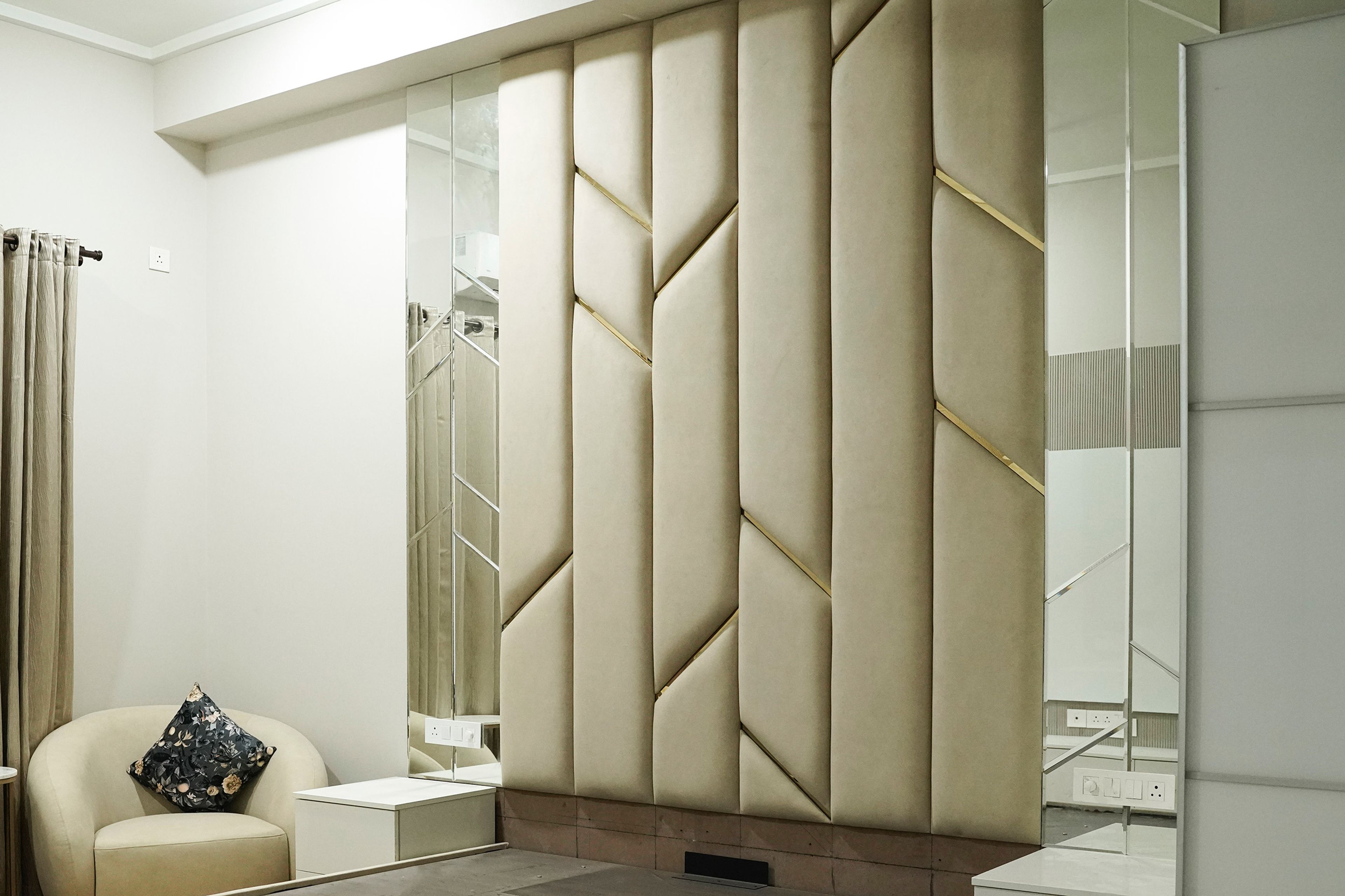 Cream Tufted Headboard wall with Geometric Mirrors