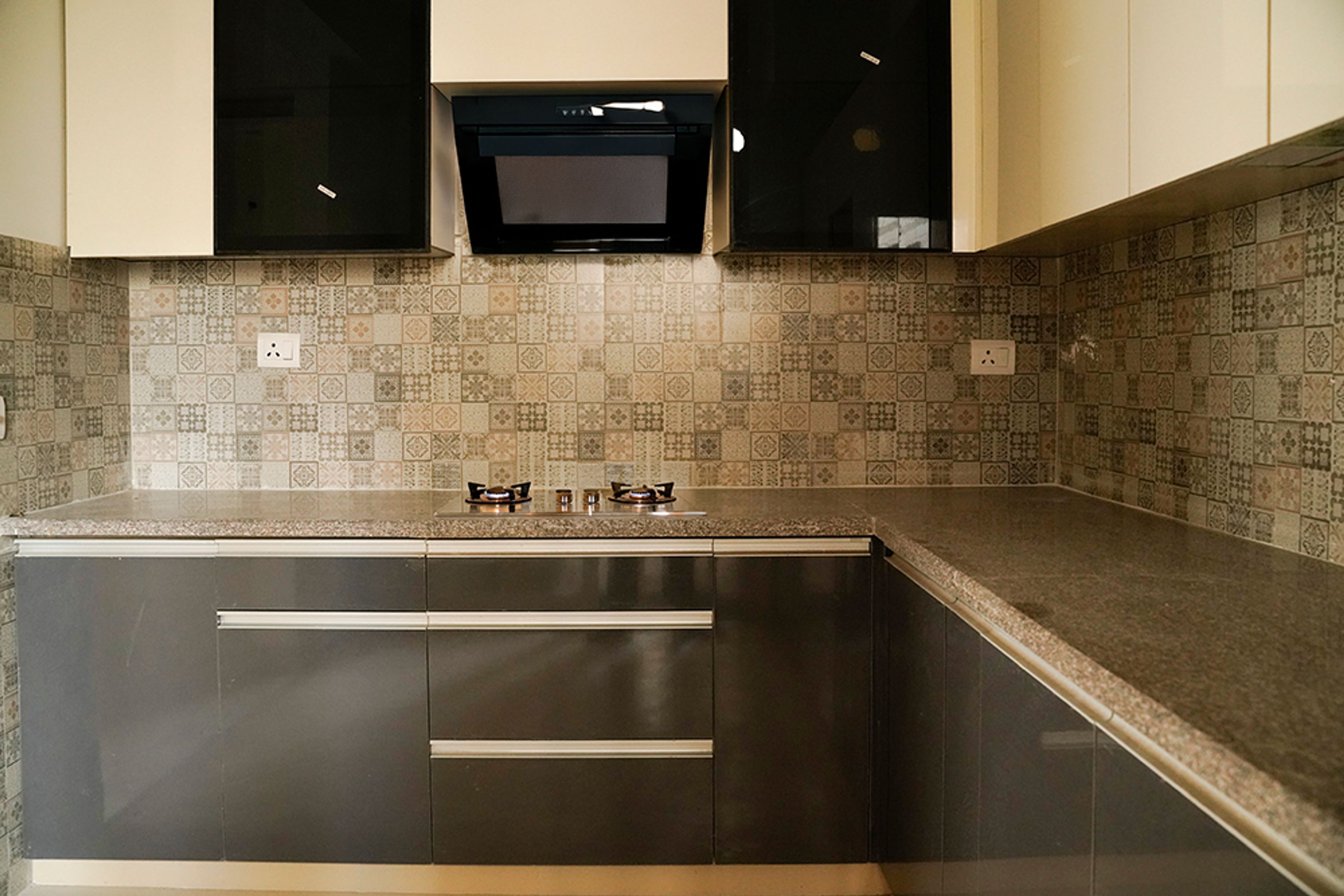 L-Shaped Kitchen Design with Moroccan Tiles Backsplash and Dark Grey Base Cabinets