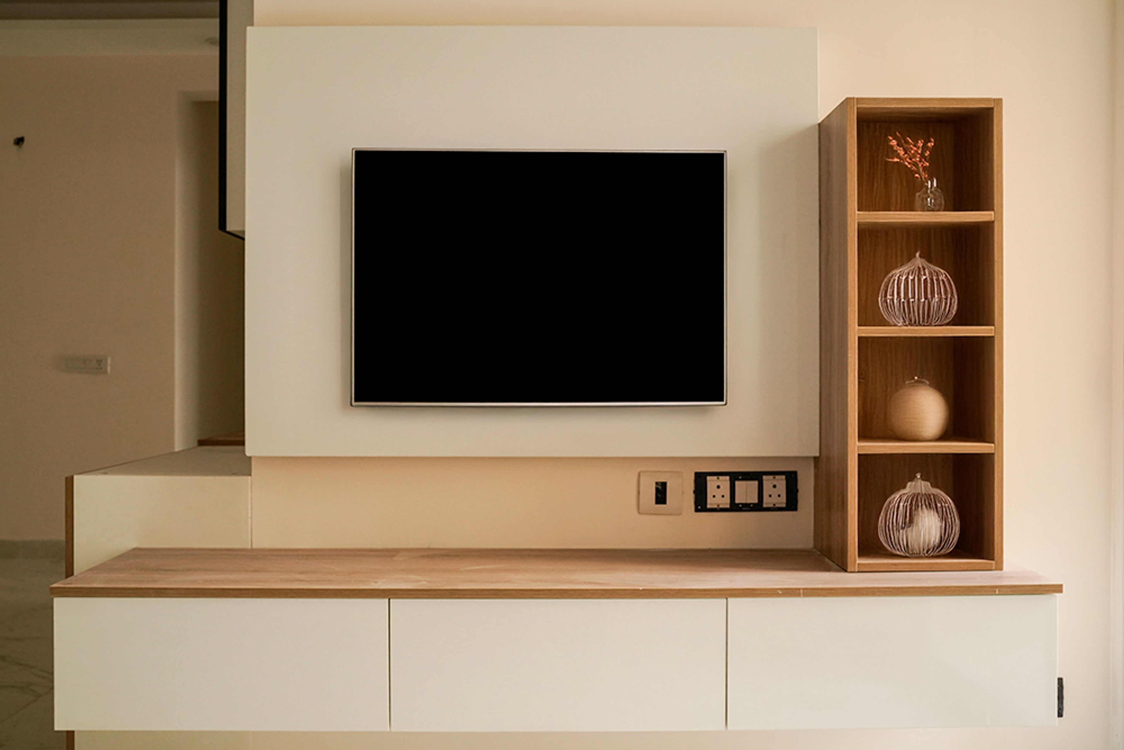 TV Unit Design with Cream Backsplash and Floating Drawers and Wooden Closed Shelves