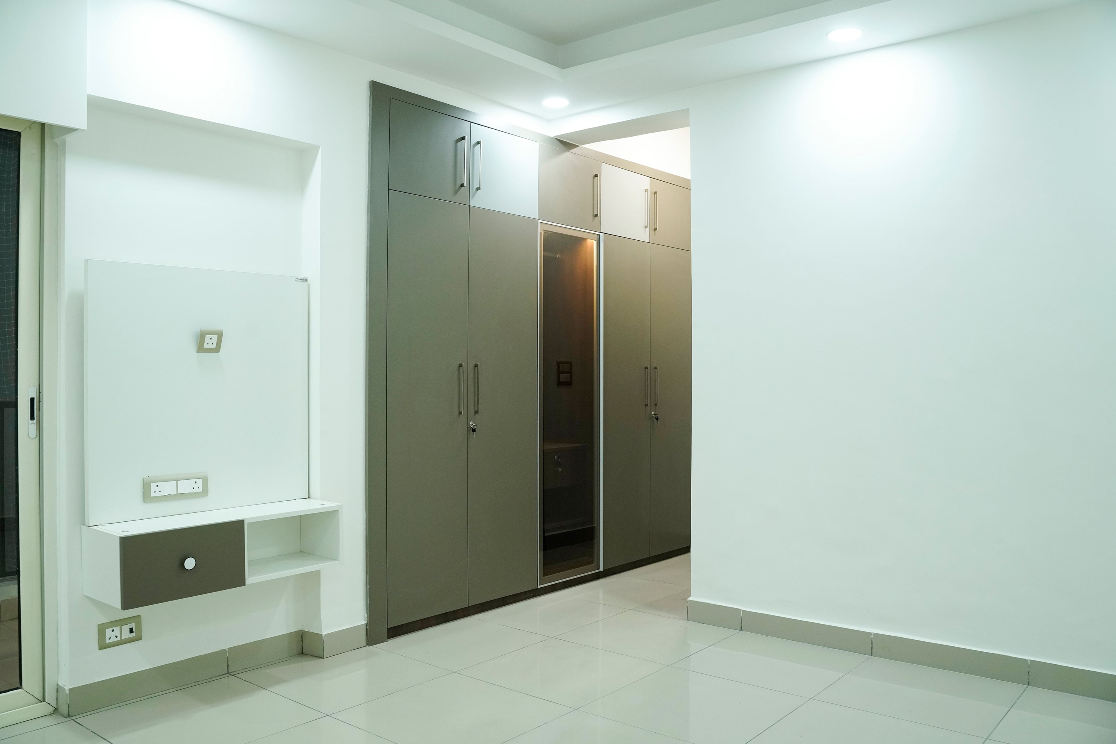 4-Door Swing Wardrobe Design with Glass Shutter Unit and White TV Unit