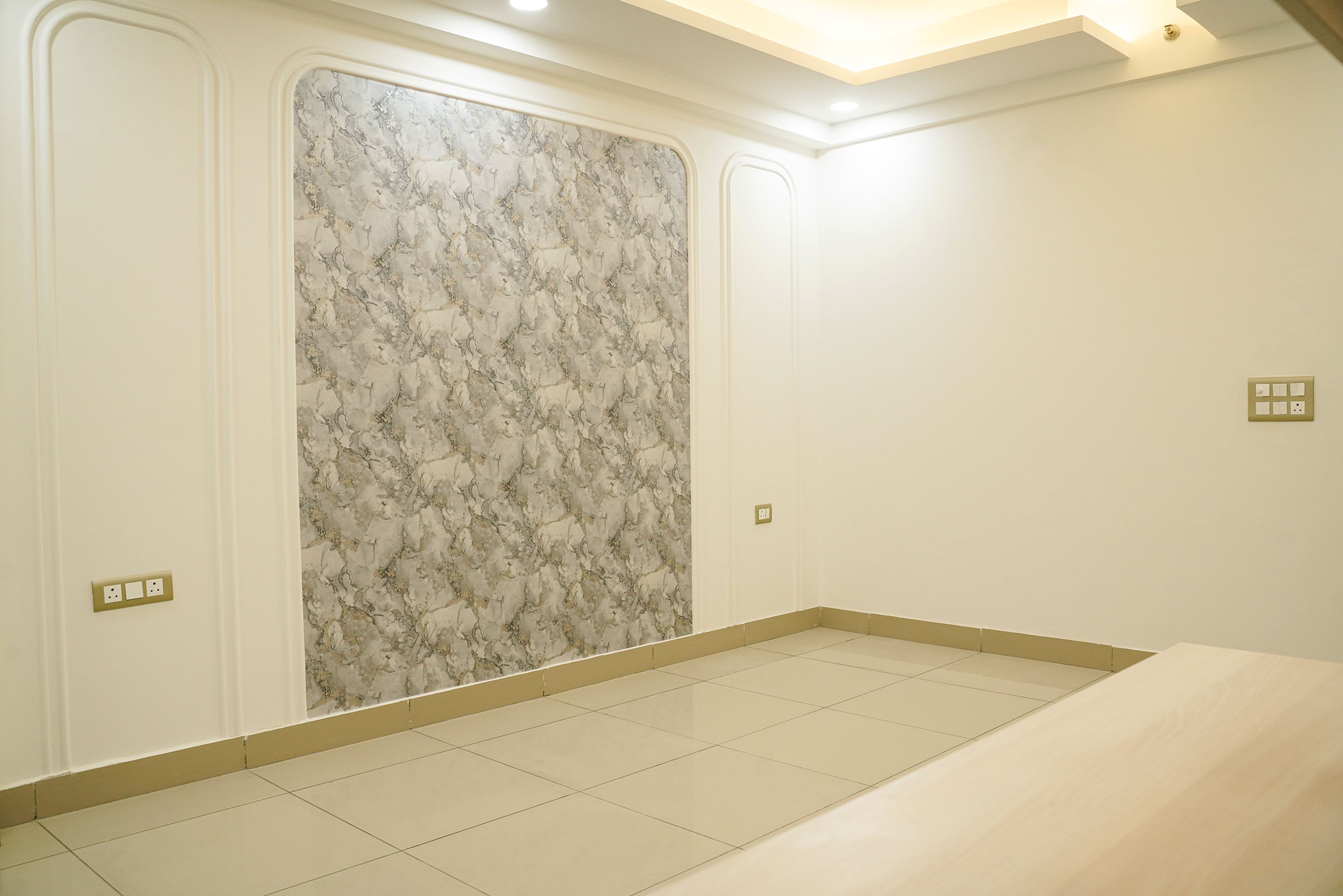 Wall Design Marble Textured Wallpaper and Off-White Walls with Trims