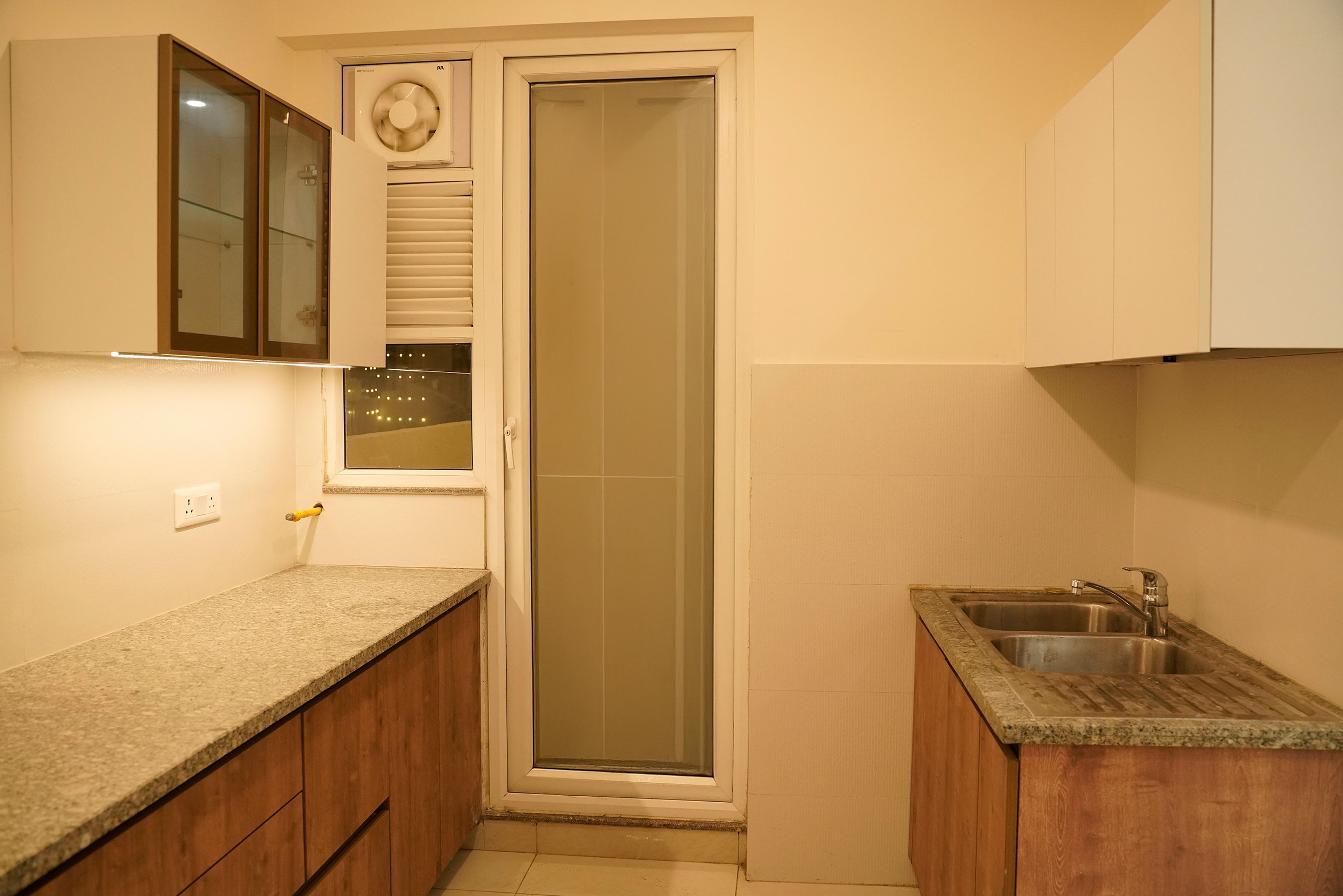 L-Shaped Kitchen Design with Granite Countertop