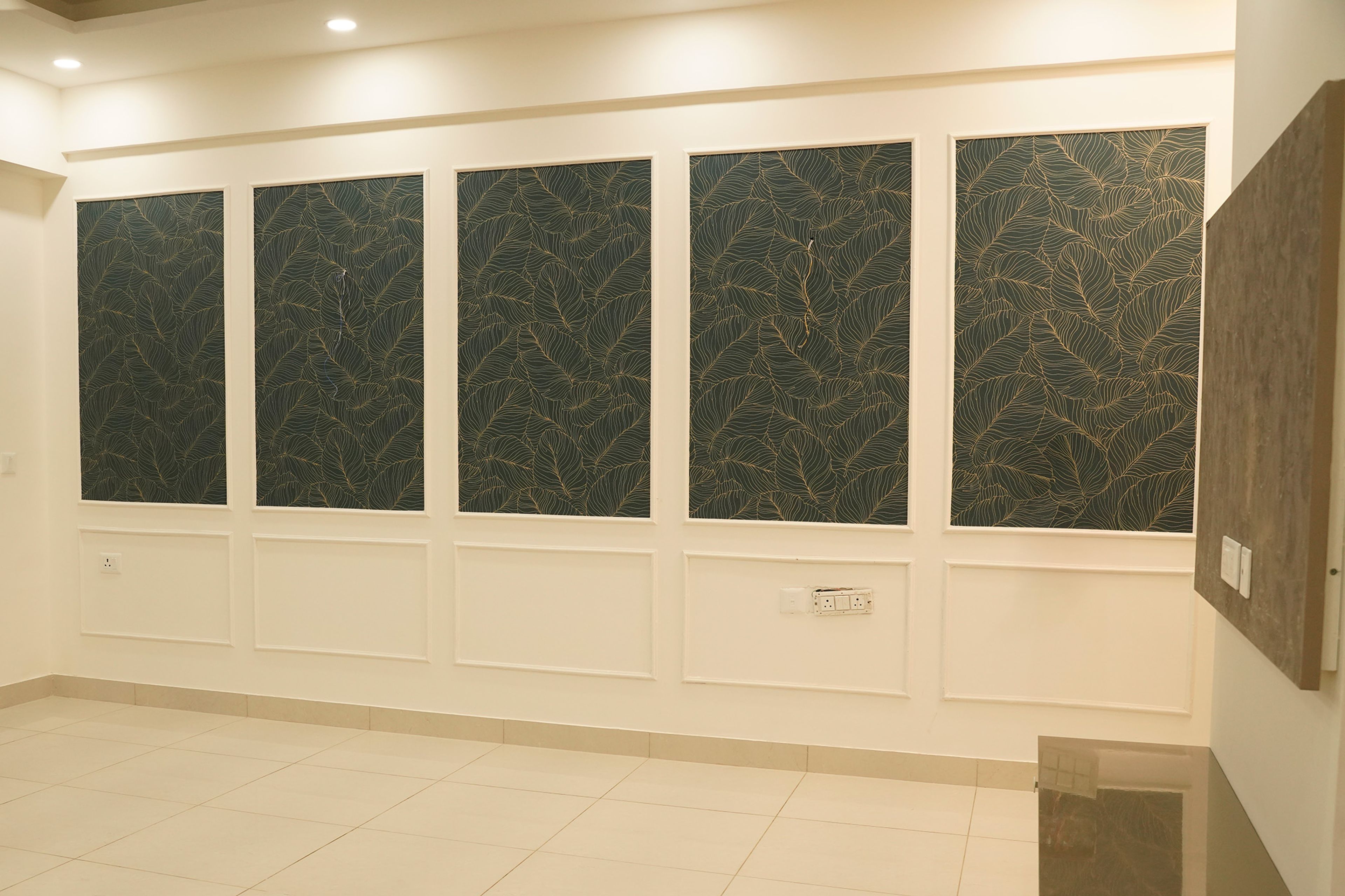 Wall Design with Dark Green and Golden Leaf Pattern Wall Panels